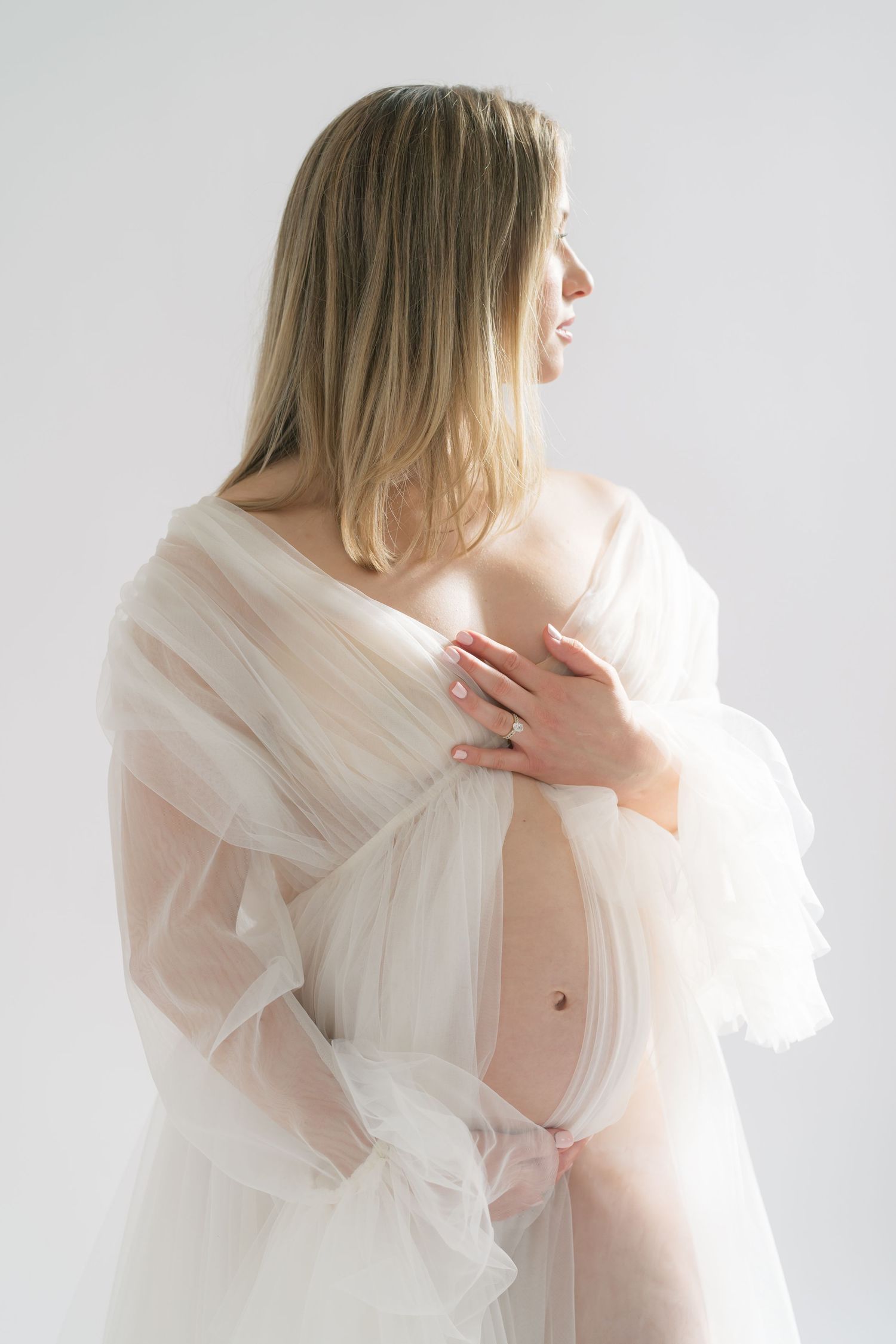 Expecting mother glowing with joy during a timeless maternity session in Valparaiso, Indiana.