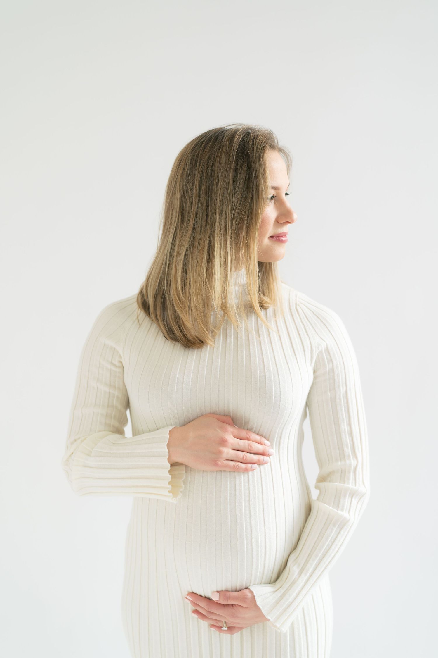 Chicago maternity photography clients traveling to Valparaiso for soft, timeless pregnancy portraits