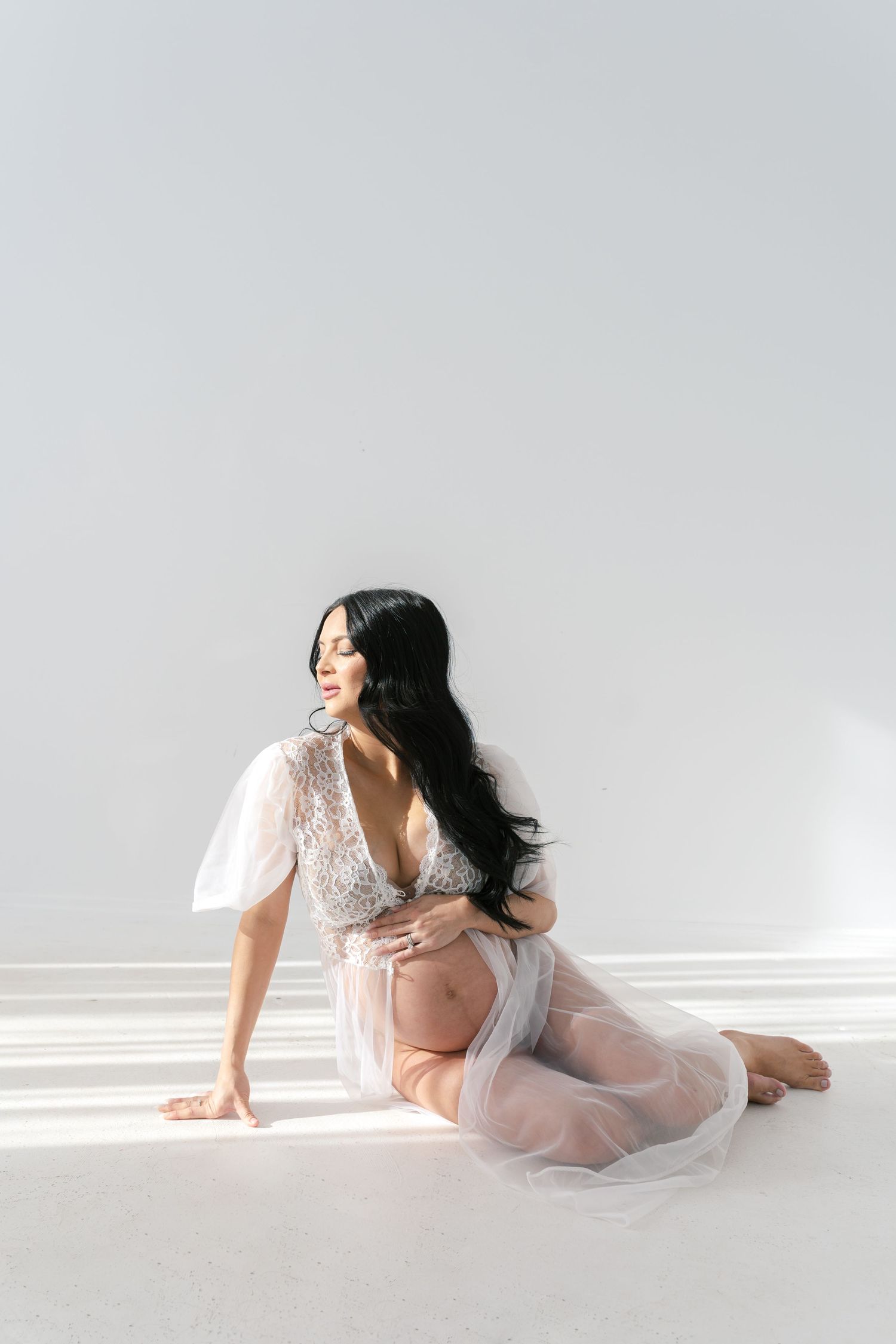 Empowering boudoir maternity session celebrating the beauty of pregnancy near Chicago.