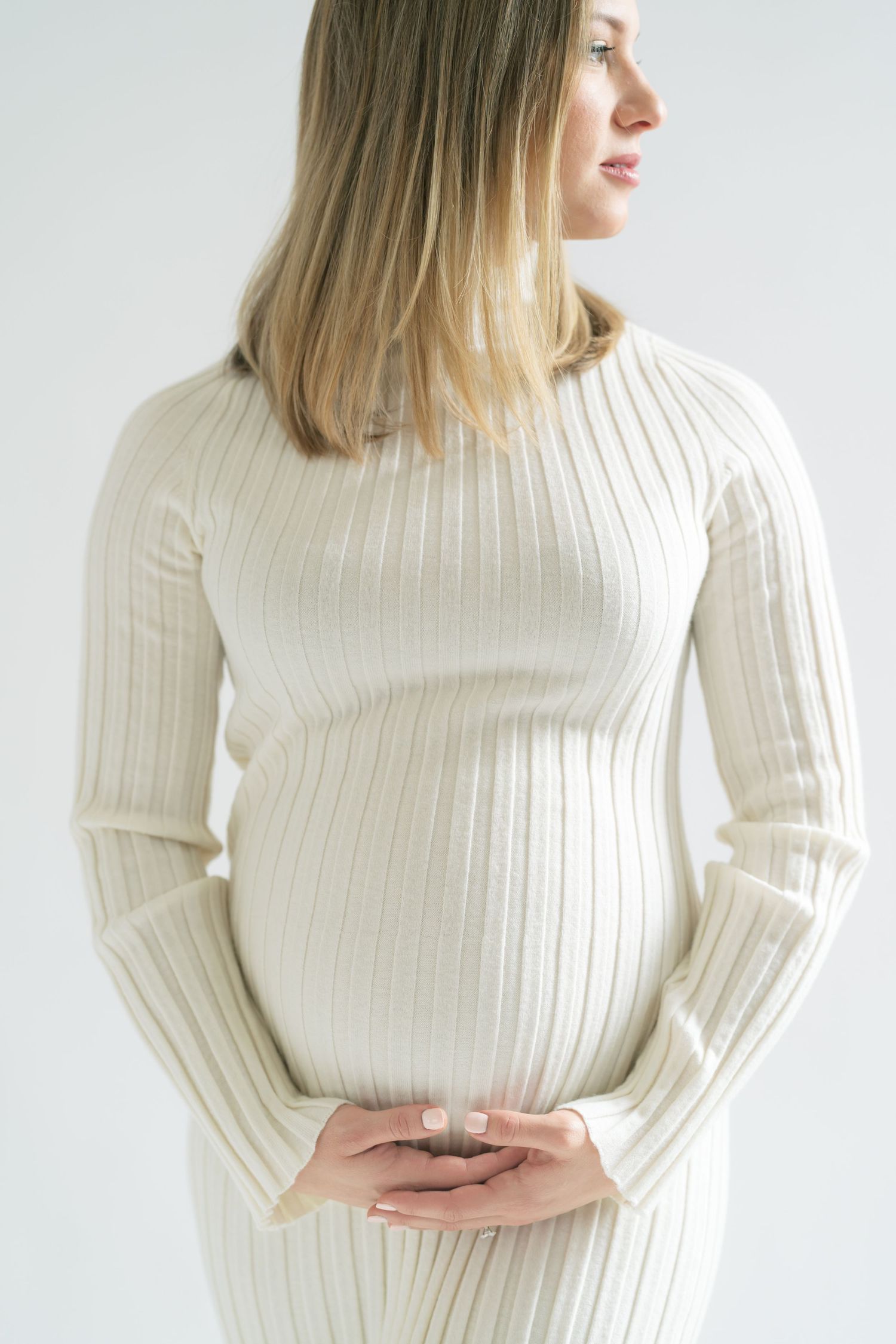 Pregnant mother from the Chicago area enjoying a calm studio maternity session in Valparaiso, Indiana.