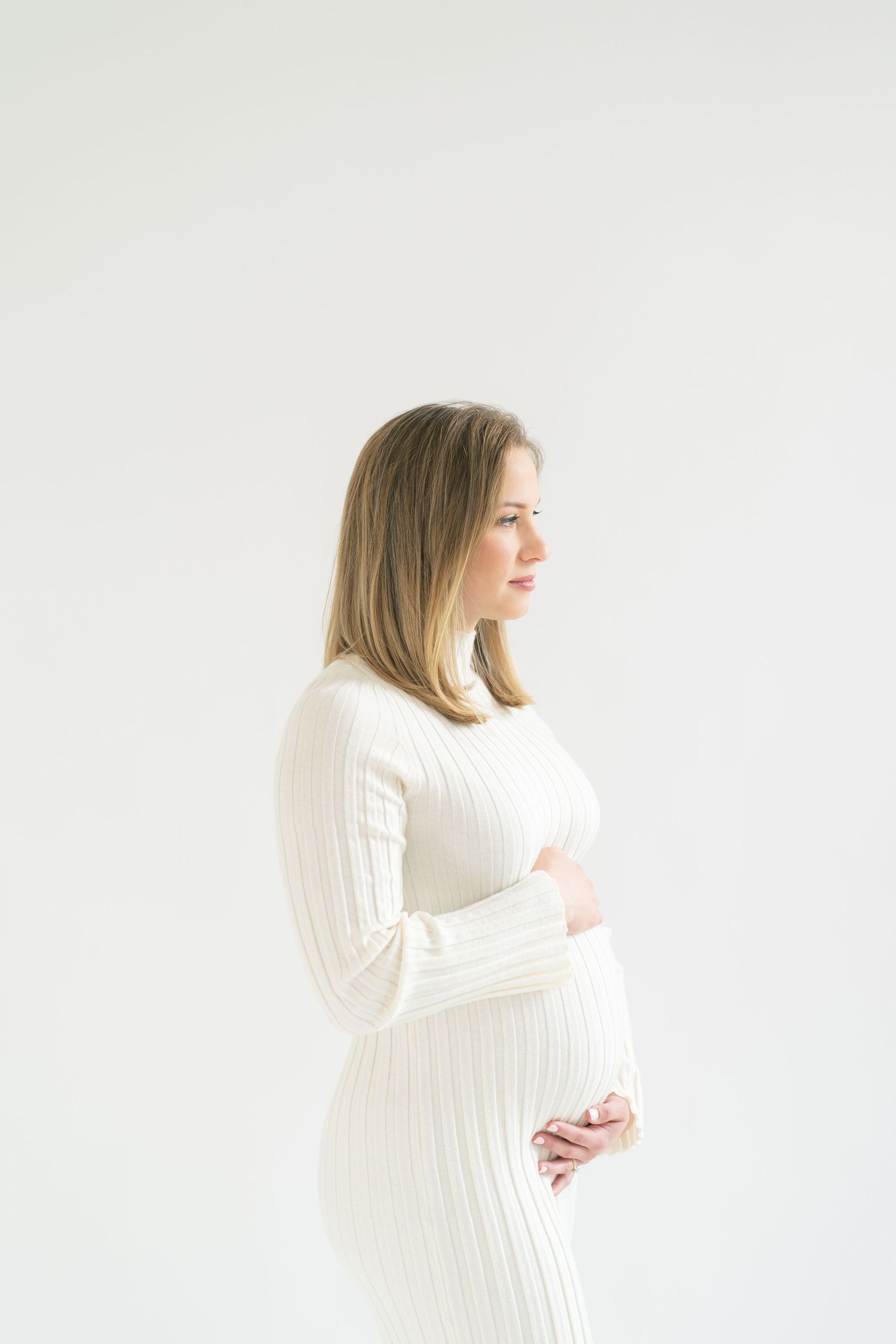 Chicago maternity photography clients traveling to Valparaiso for soft, timeless pregnancy portraits