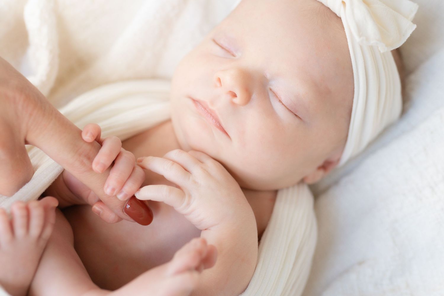 Minimalist newborn studio session in downtown Valparaiso, Indiana featuring organic textures and soft tones.