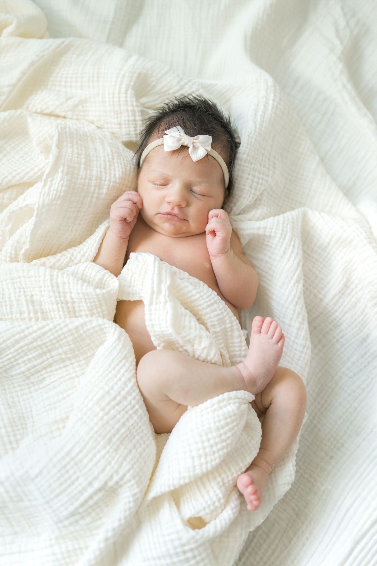 Peaceful newborn sleeping at home during a lifestyle newborn photography session in Valparaiso, Indiana.