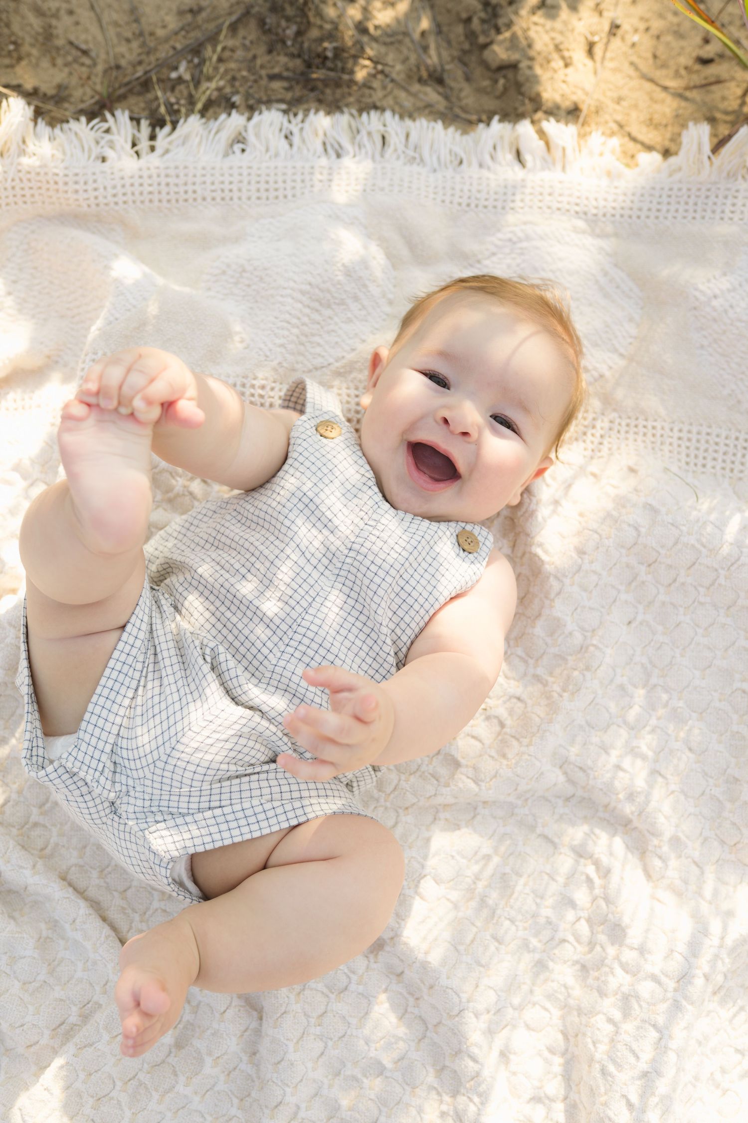 Happy baby smiling during a milestone photography session in Valparaiso, Indiana.