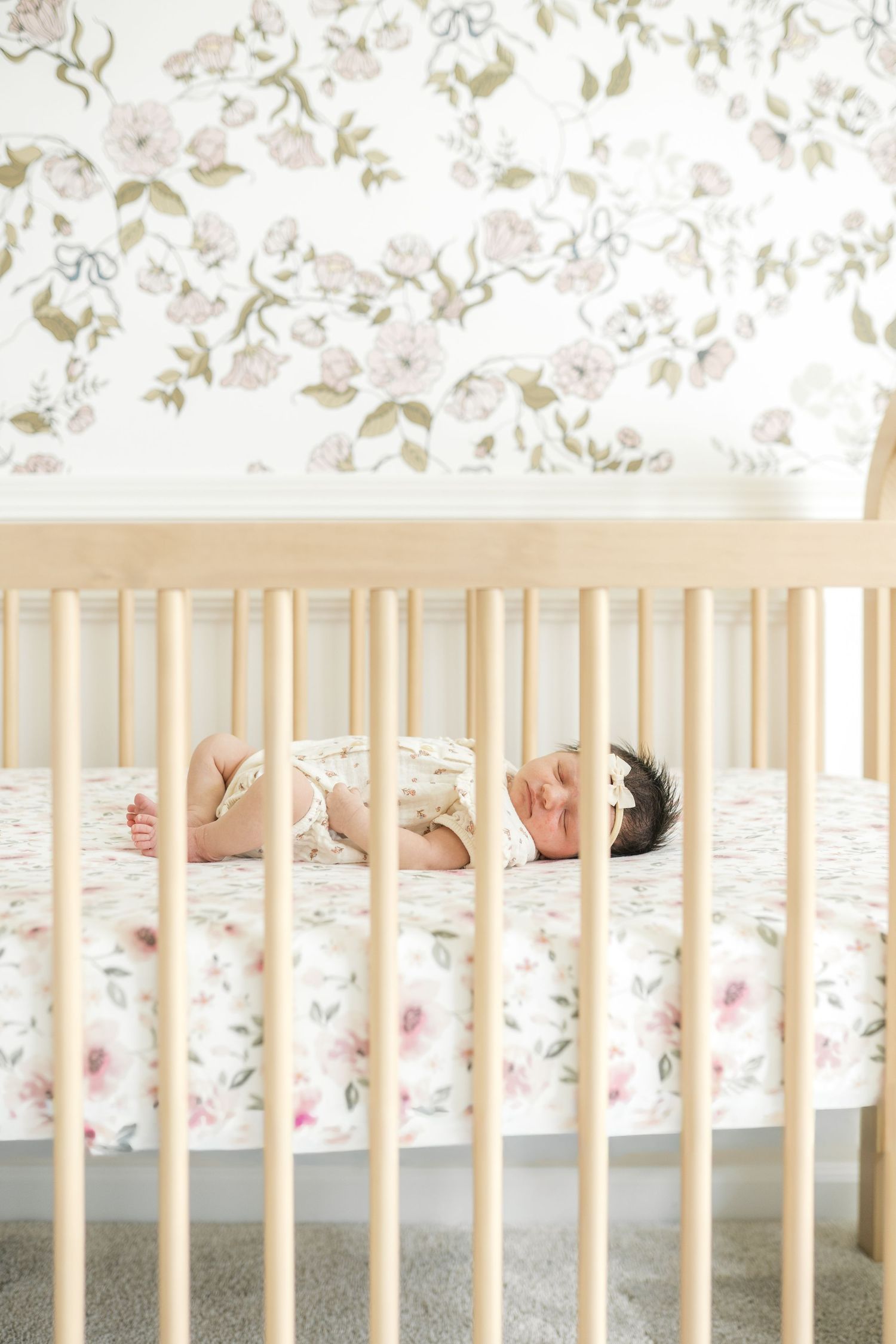 Peaceful newborn sleeping at home during a lifestyle newborn photography session in Valparaiso, Indiana.