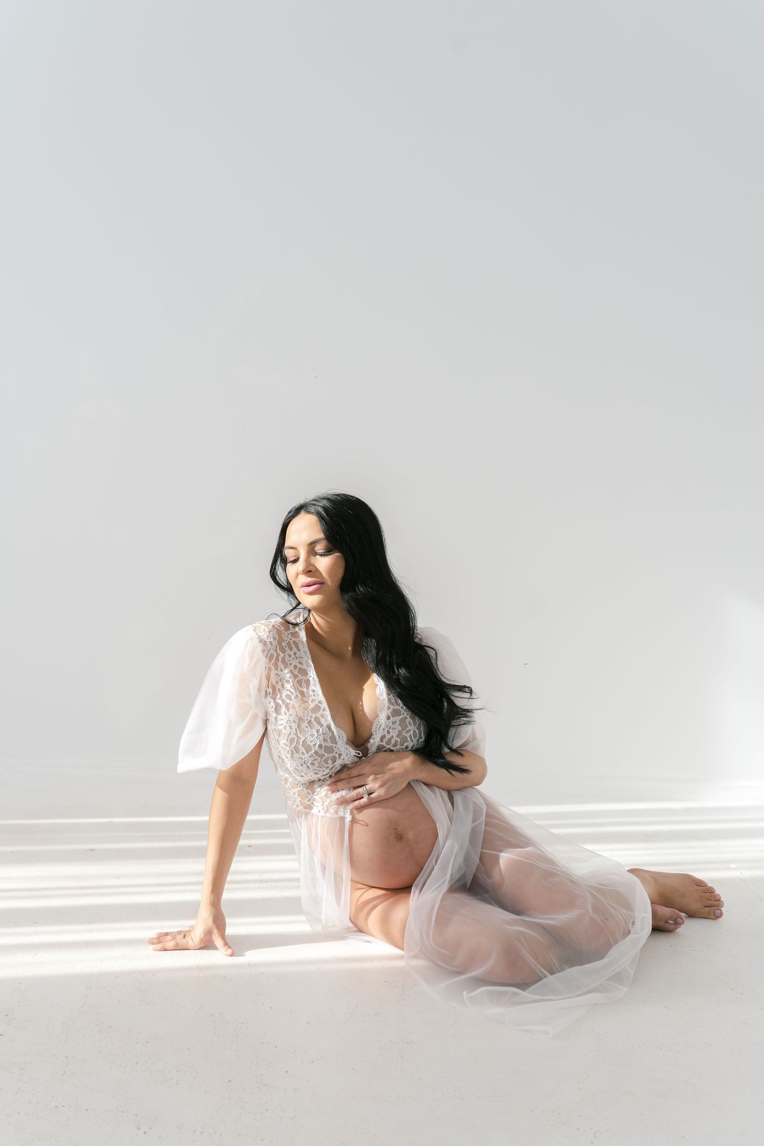Empowering boudoir maternity session celebrating the beauty of pregnancy near Chicago.