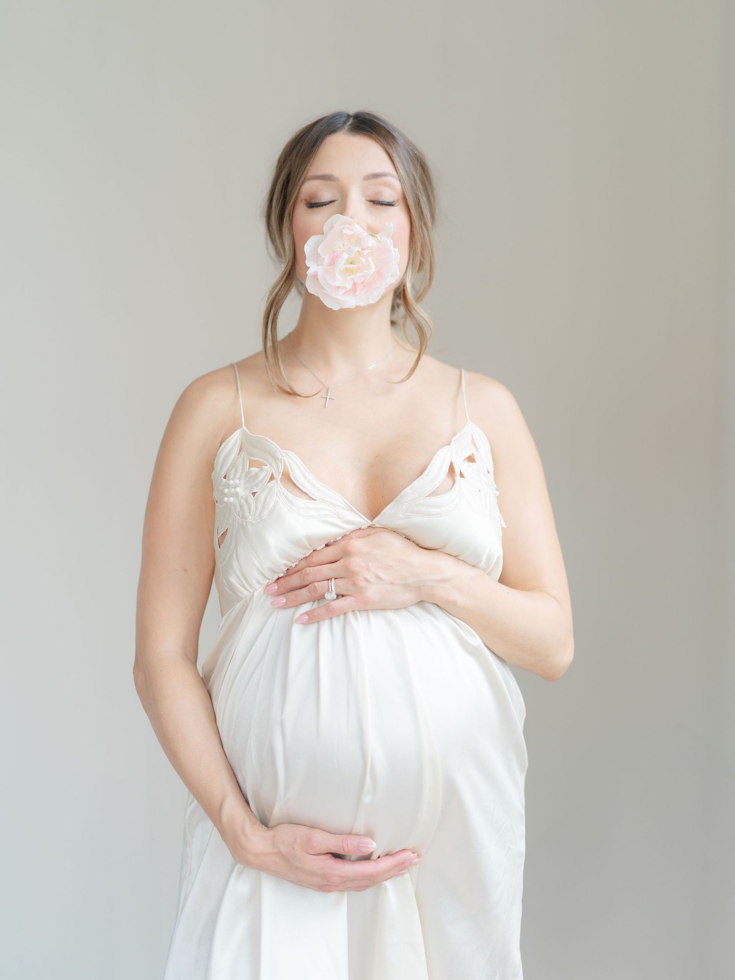 Emotional maternity portrait celebrating pregnancy in a natural light studio in Valparaiso, Indiana.