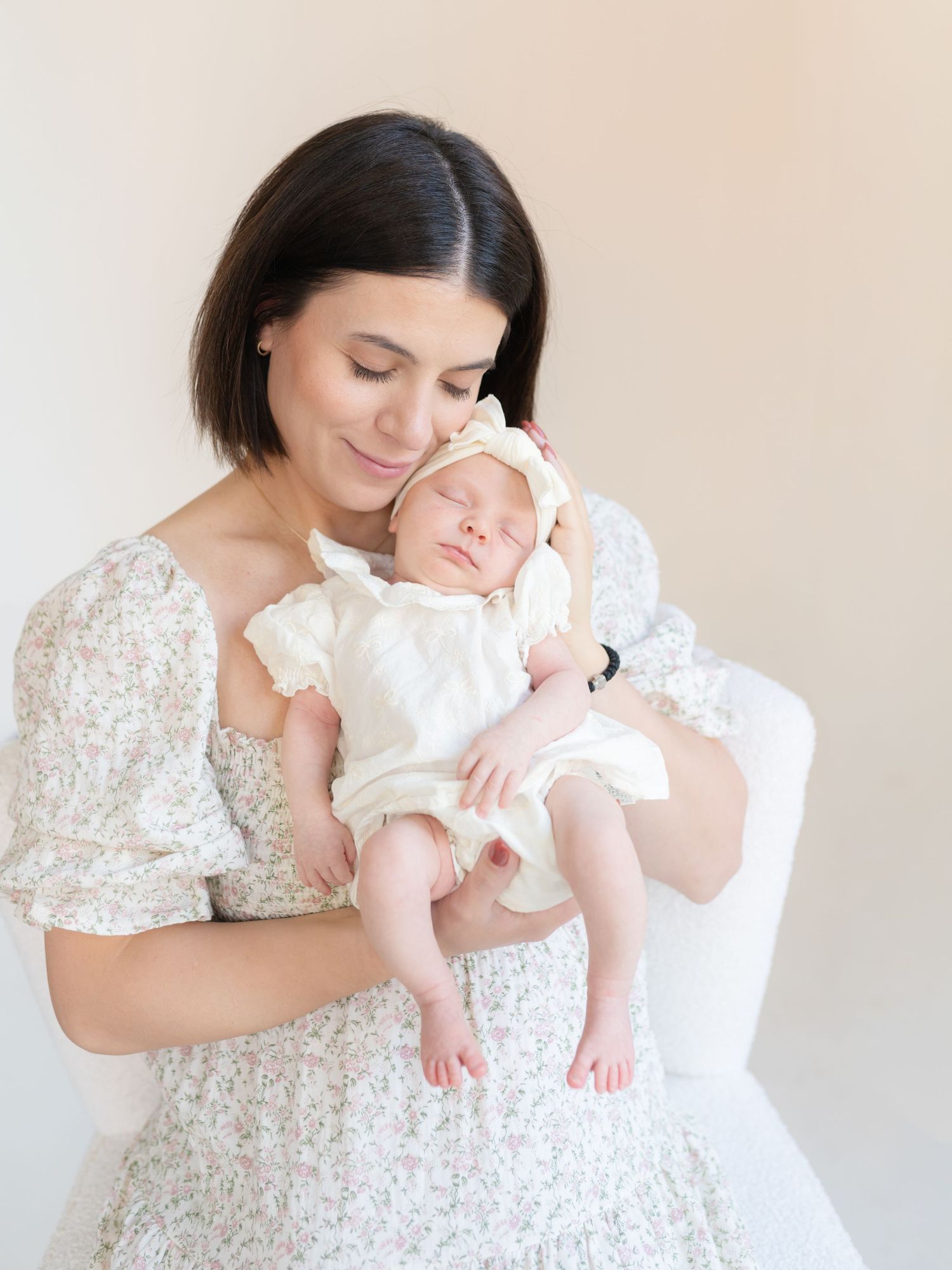 Studio newborn photography session in downtown Valparaiso, Indiana featuring a calm, sleepy newborn baby.