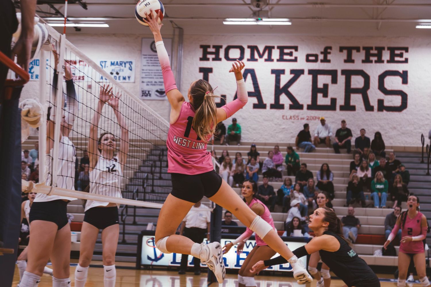 West Linn girls varsity volleyball vs. Lake Oswego, photographed by Miles Butler Photography in Oregon.