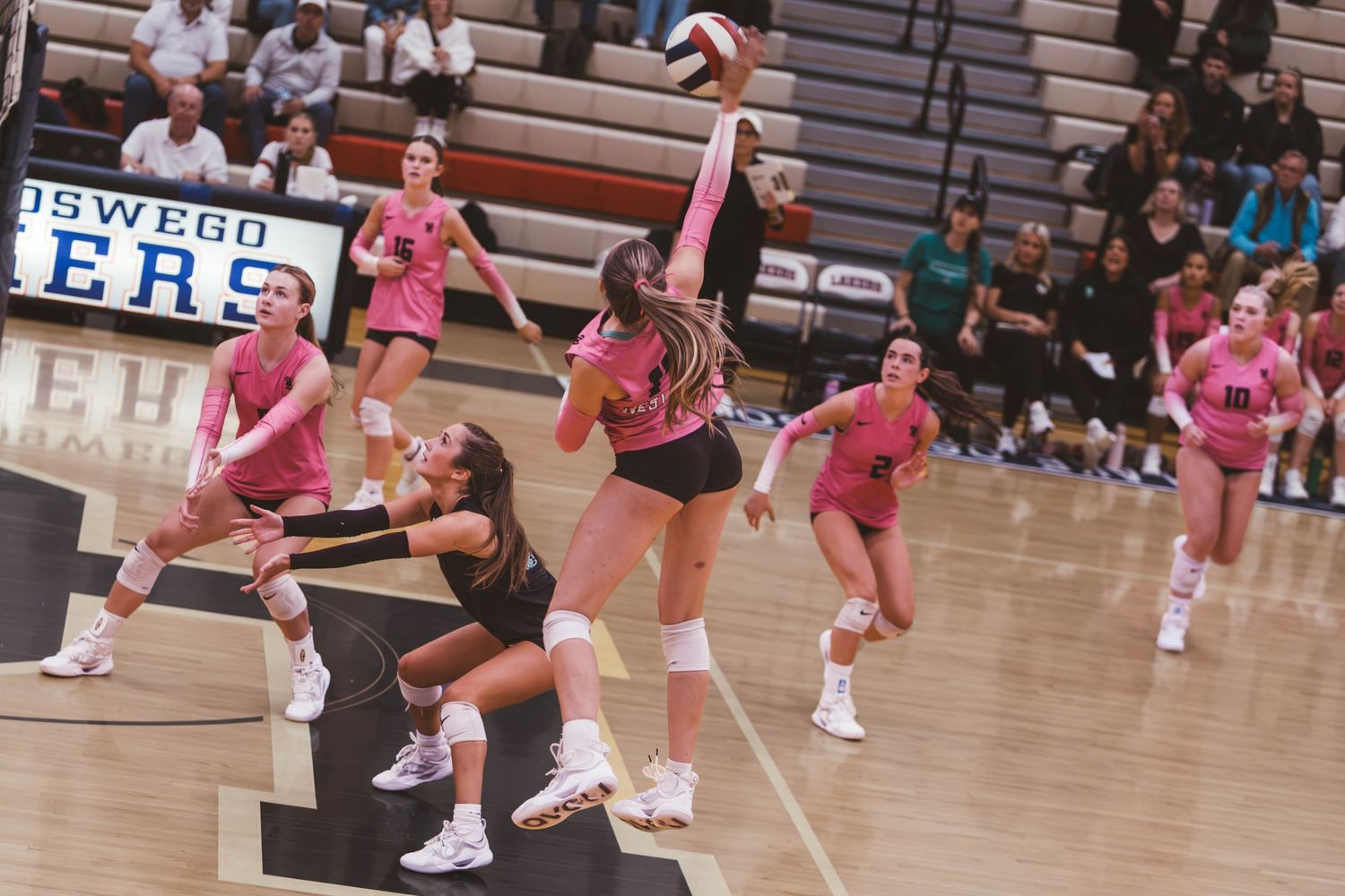 West Linn girls varsity volleyball vs. Lake Oswego, photographed by Miles Butler Photography in Oregon.