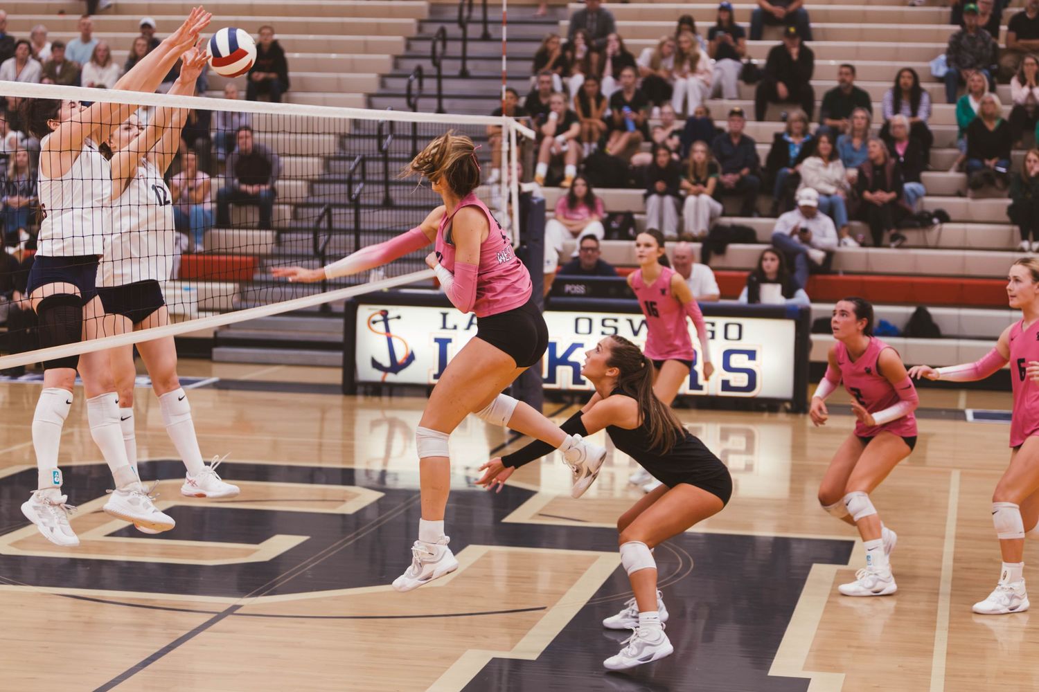 West Linn girls varsity volleyball vs. Lake Oswego, photographed by Miles Butler Photography in Oregon.