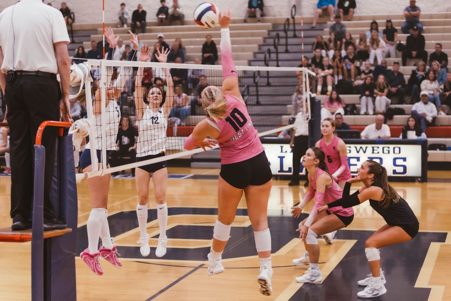 West Linn girls varsity volleyball vs. Lake Oswego, photographed by Miles Butler Photography in Oregon.