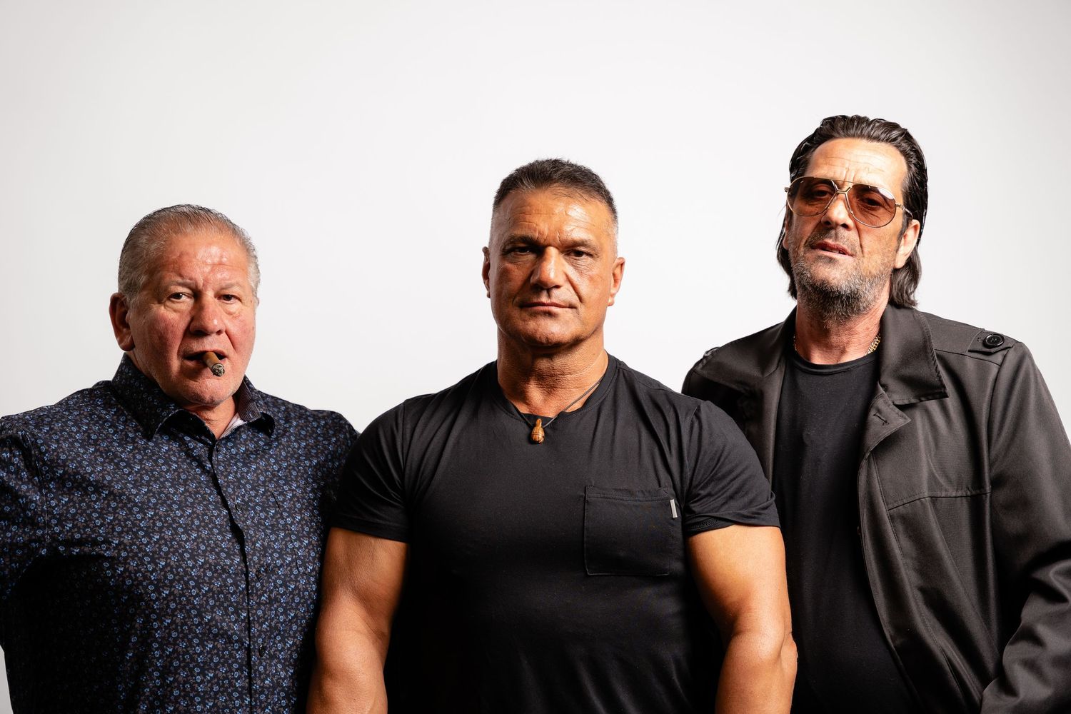 Group portrait series showing multiple people in casual black attire against white background.