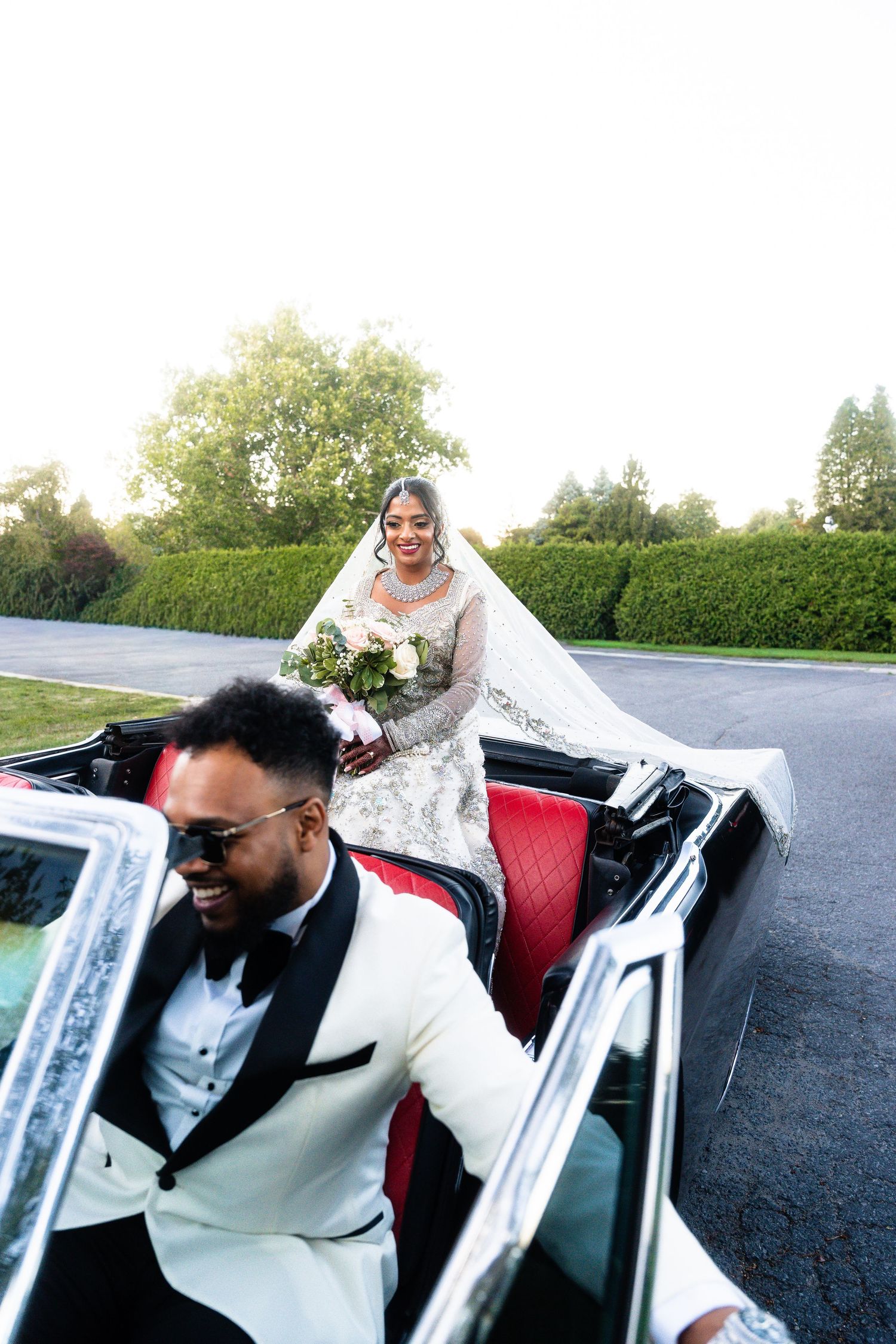 A sequence of photos showing someone getting into a car wearing a white sweater and sunglasses.