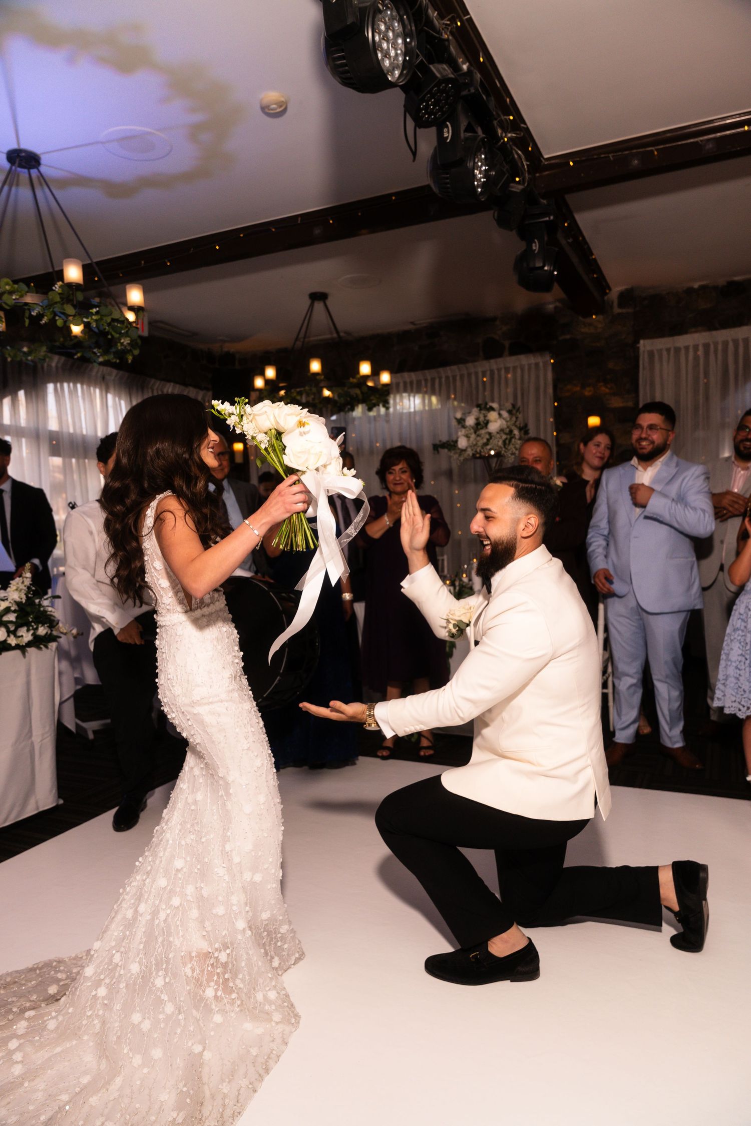 Wedding couple performs a fun choreographed dance sequence during their reception celebration.