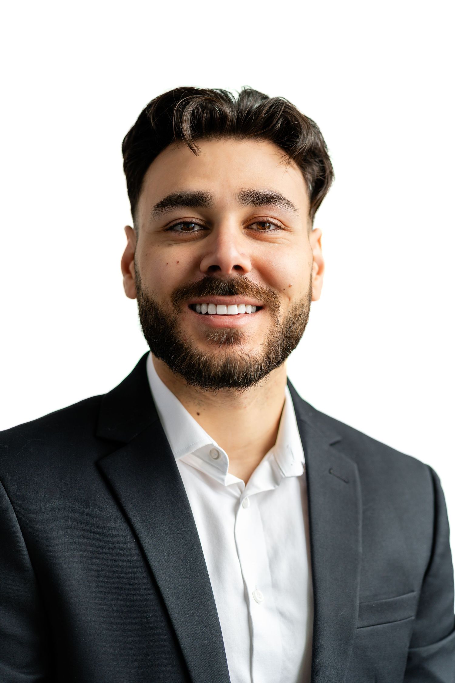 Business headshots showing person in dark suit and white shirt against white background.