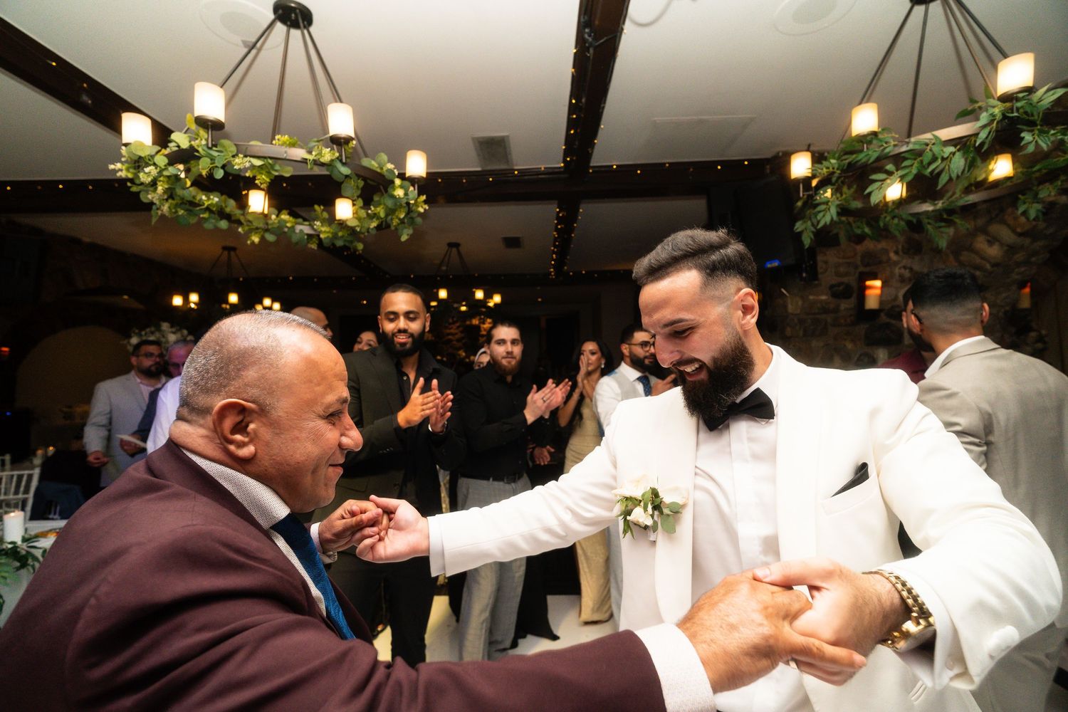 A collage of candid wedding reception moments showing guests dancing and celebrating together on the dance floor.