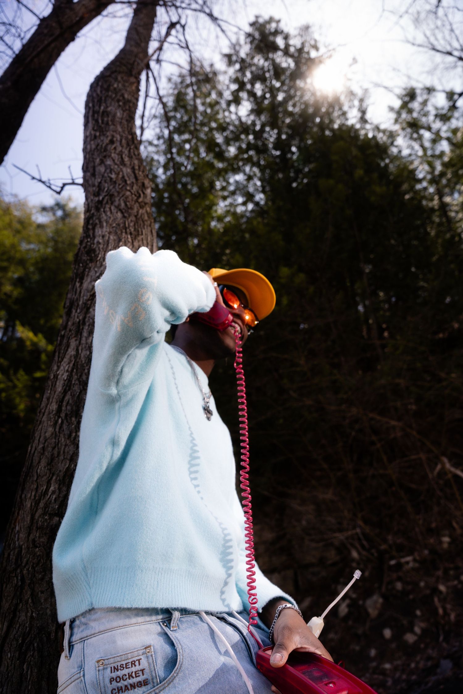 Close-up of light blue clothing against natural outdoor background.