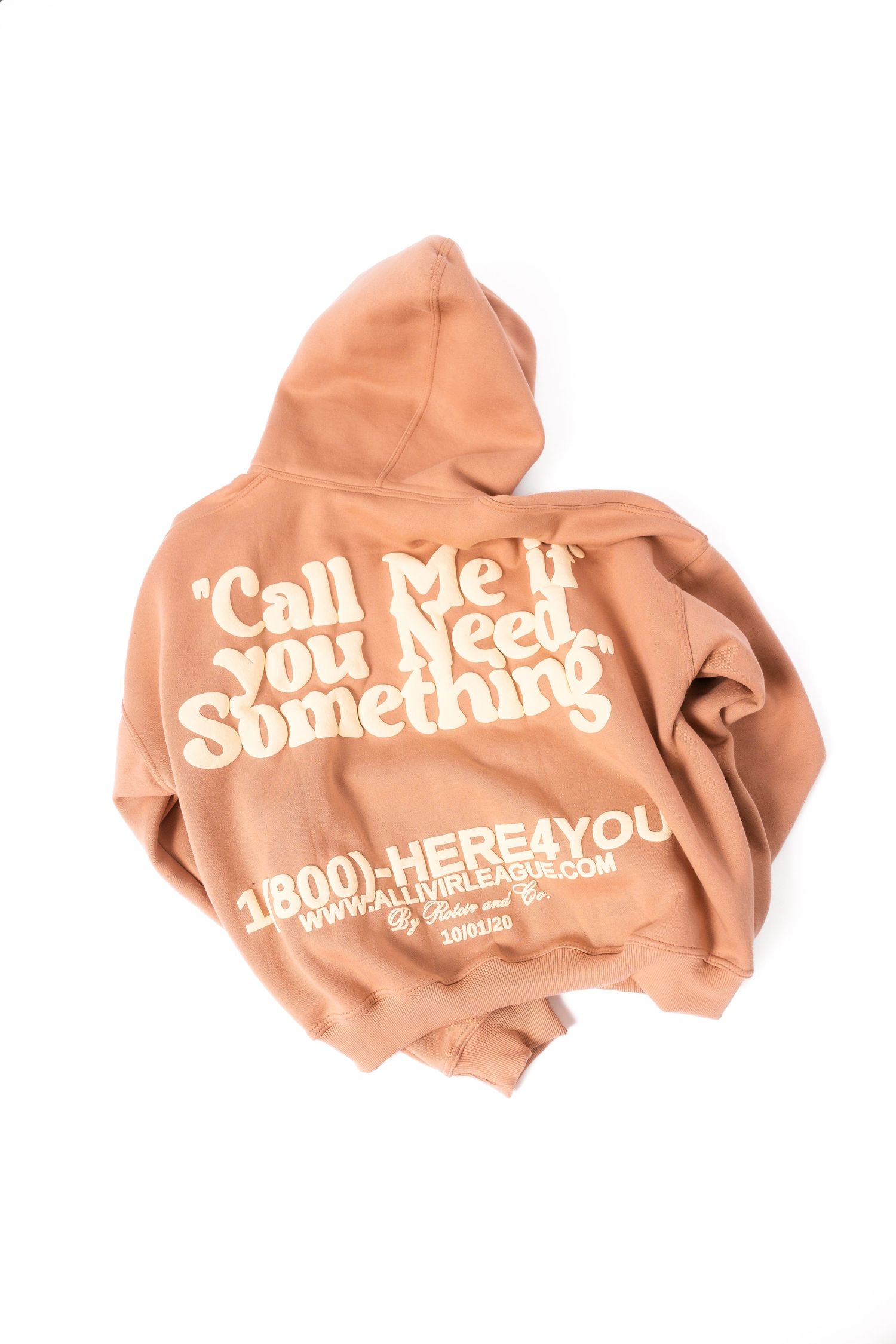 Peach colored hoodie with retro-style text 'Call Me If You Need Something' and phone number printed on back.