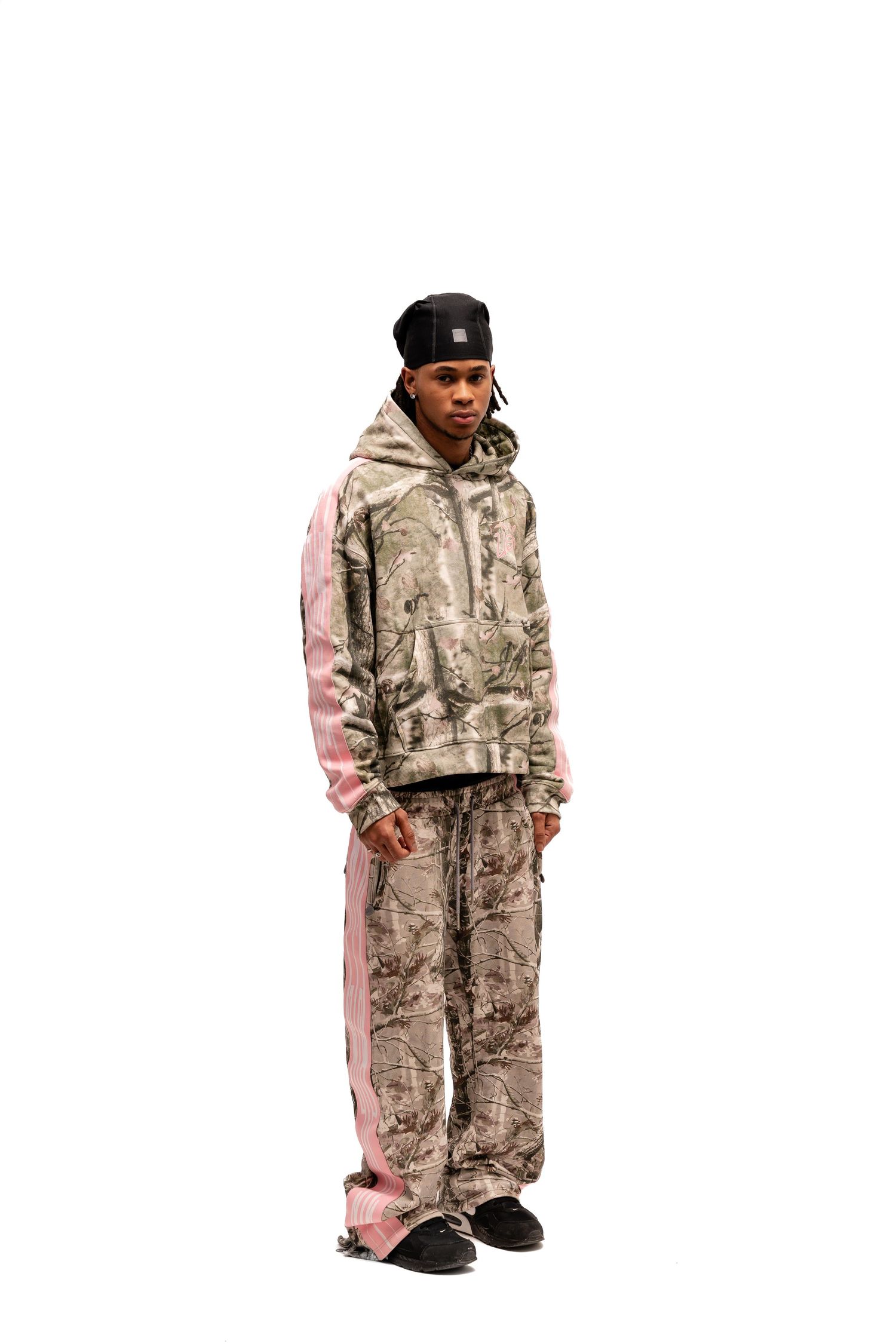 Camouflage winter outfit with pink details shown from different angles.