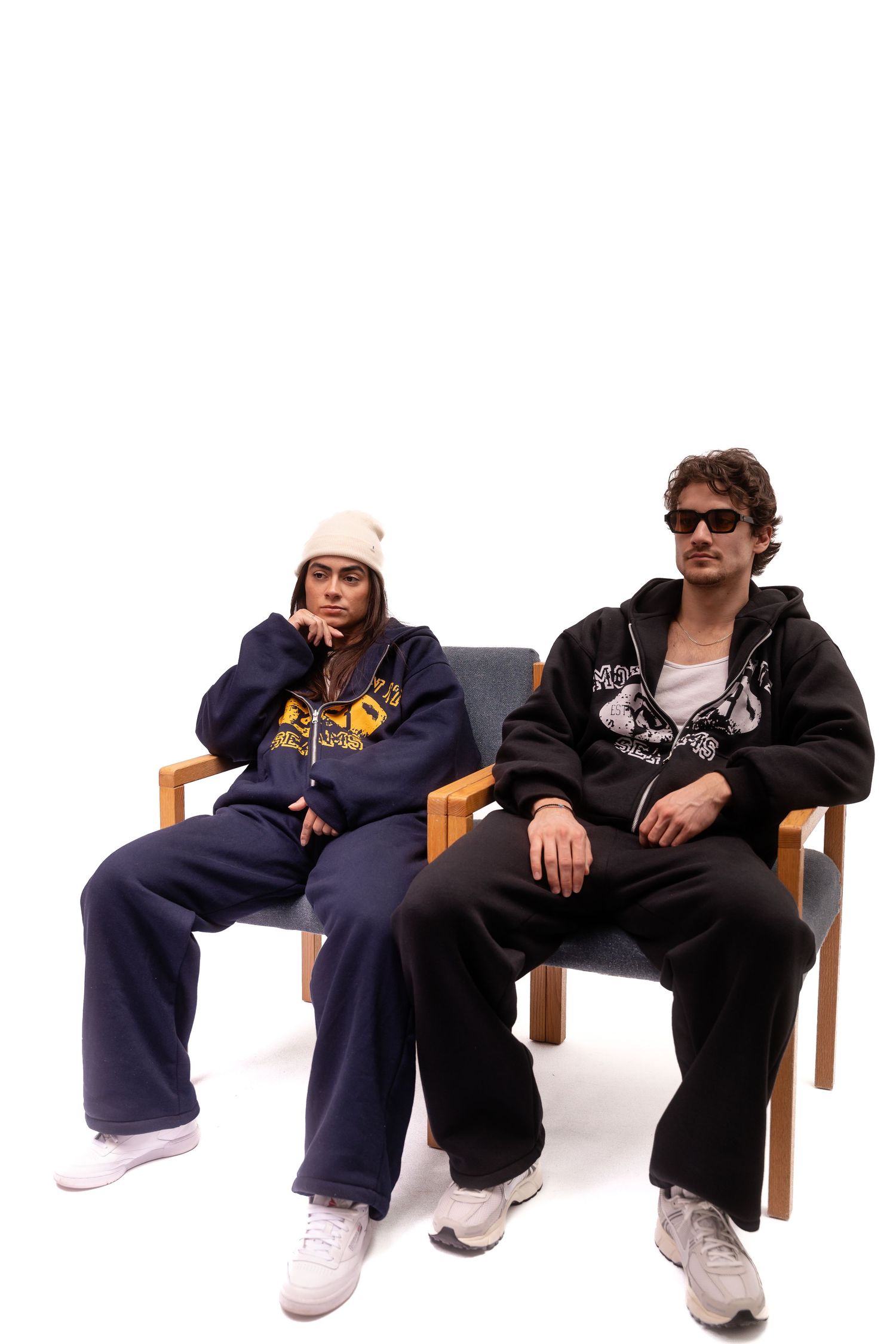 Group relaxing on wooden bench wearing casual sportswear.