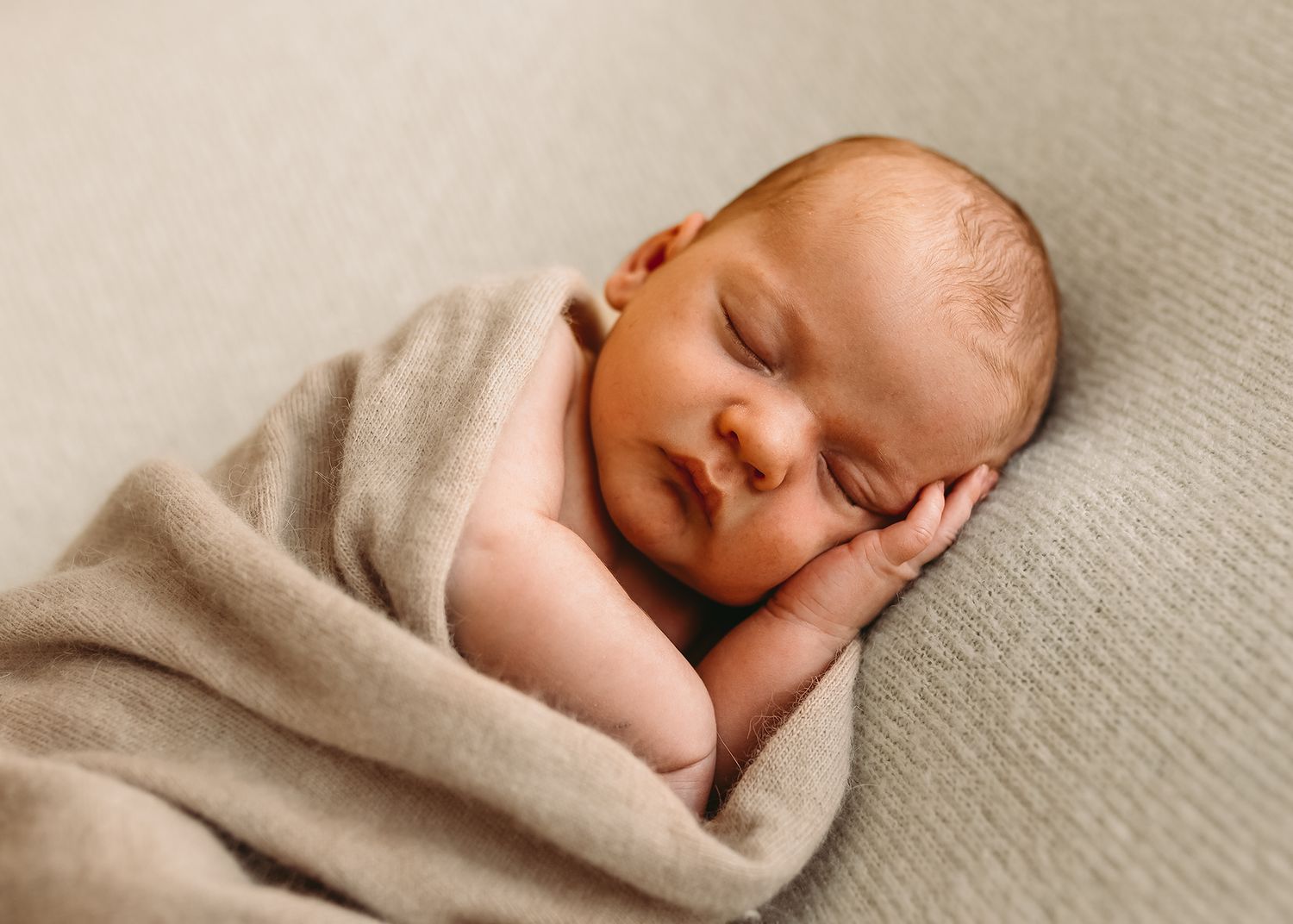 newborn-baby-wrapped-studio