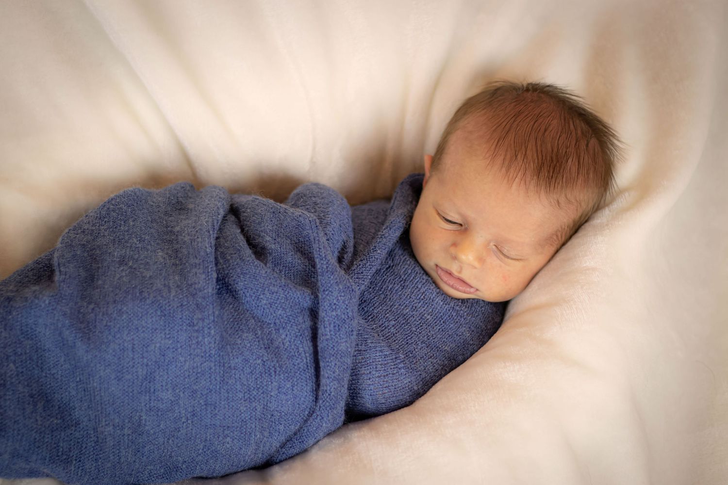 Sleepy newborn boy