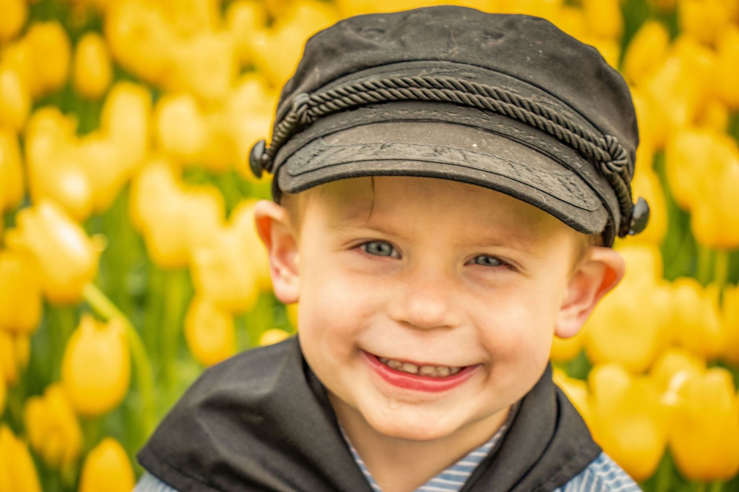 Toddler in dutch outfit with tulips