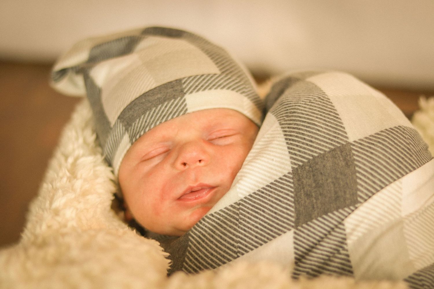 Newborn boy wrapped in a swaddle