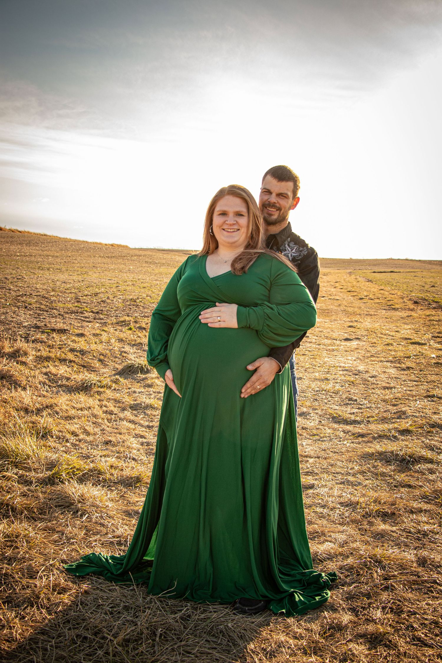 Expectant mom and dad at Sunset