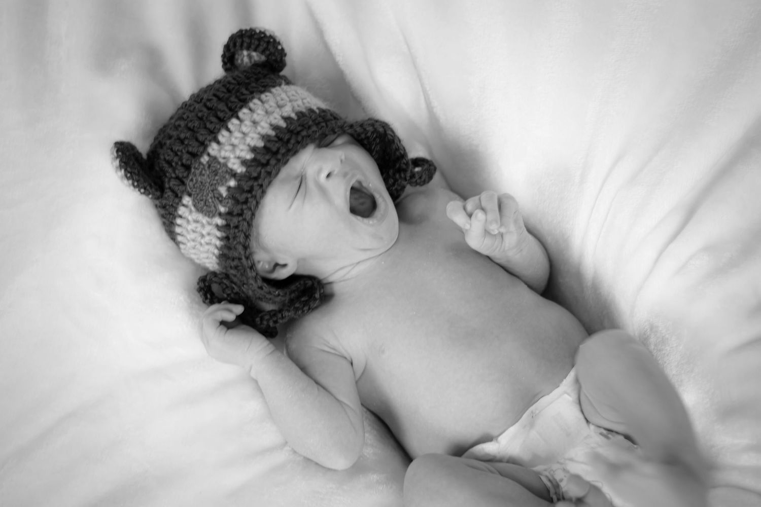 Newborn boy with Notre Dame hat