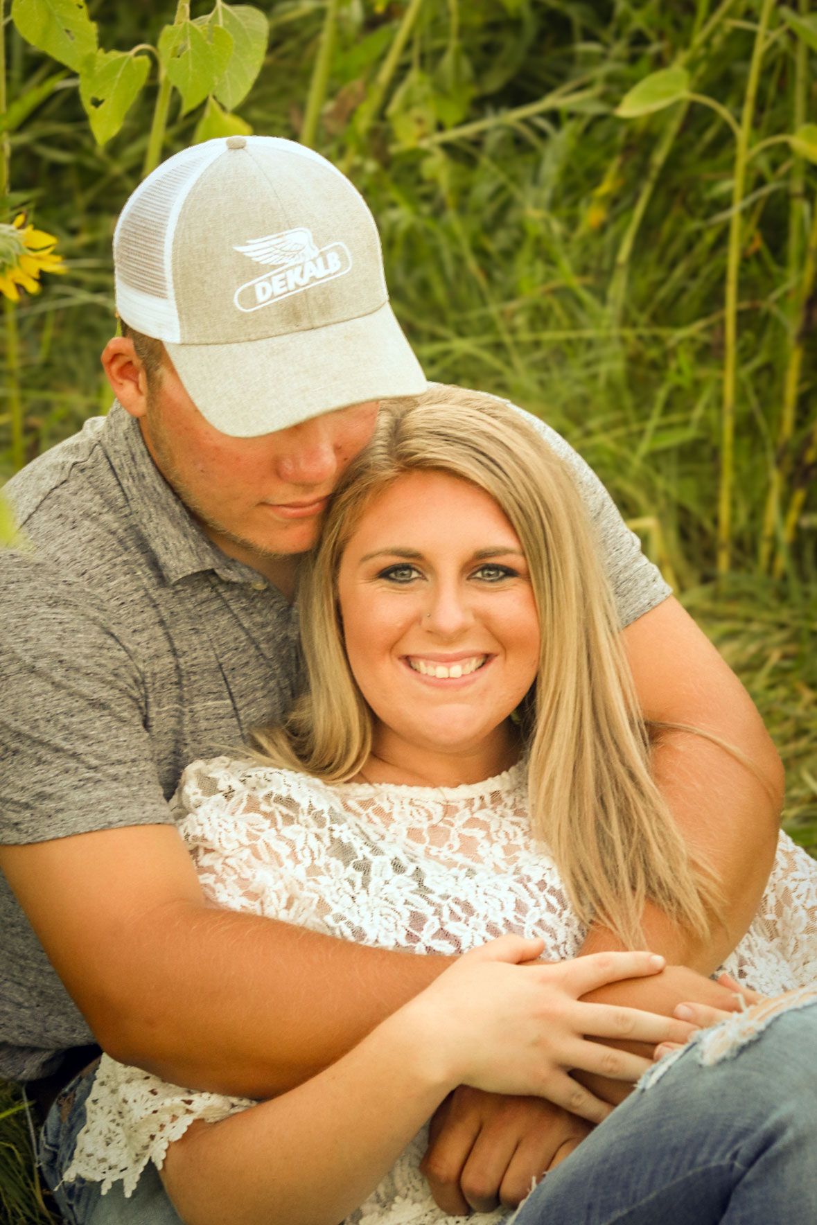 Iowa couple in sunflowerfield