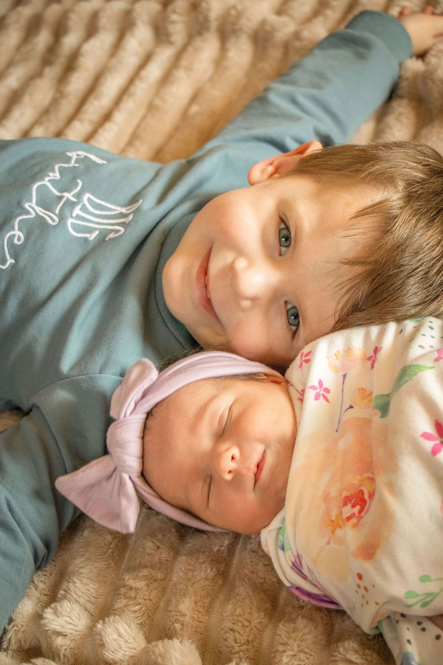 Newborn baby girl with big brother
