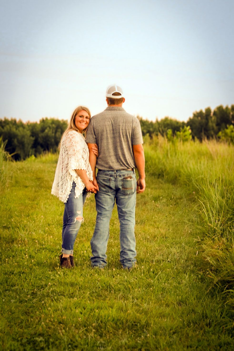 Couple in Iowa sunflower field