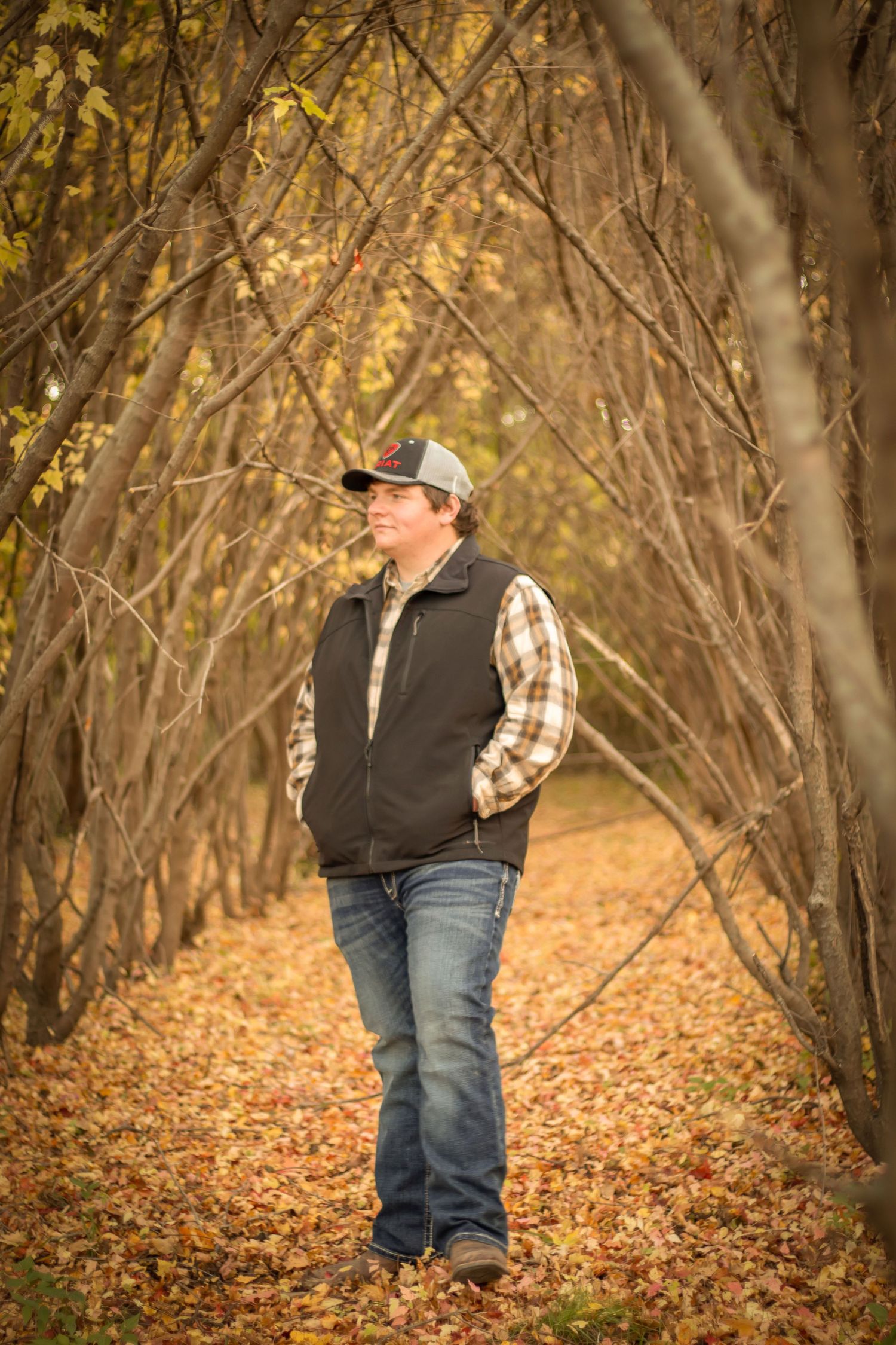 Senior boy in fall leaves