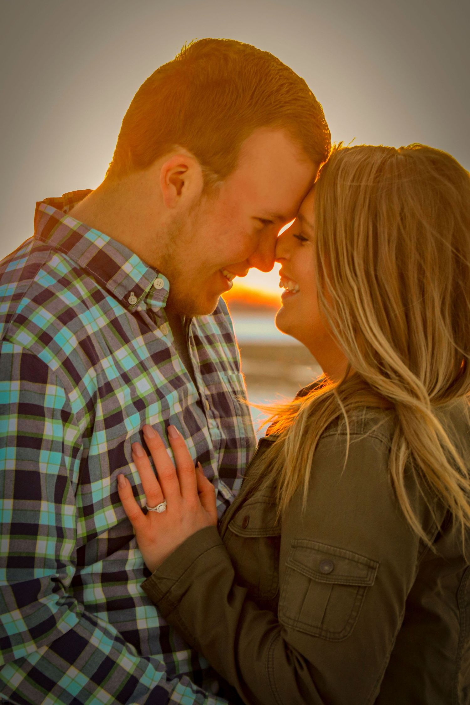 Engaged couple at sunset