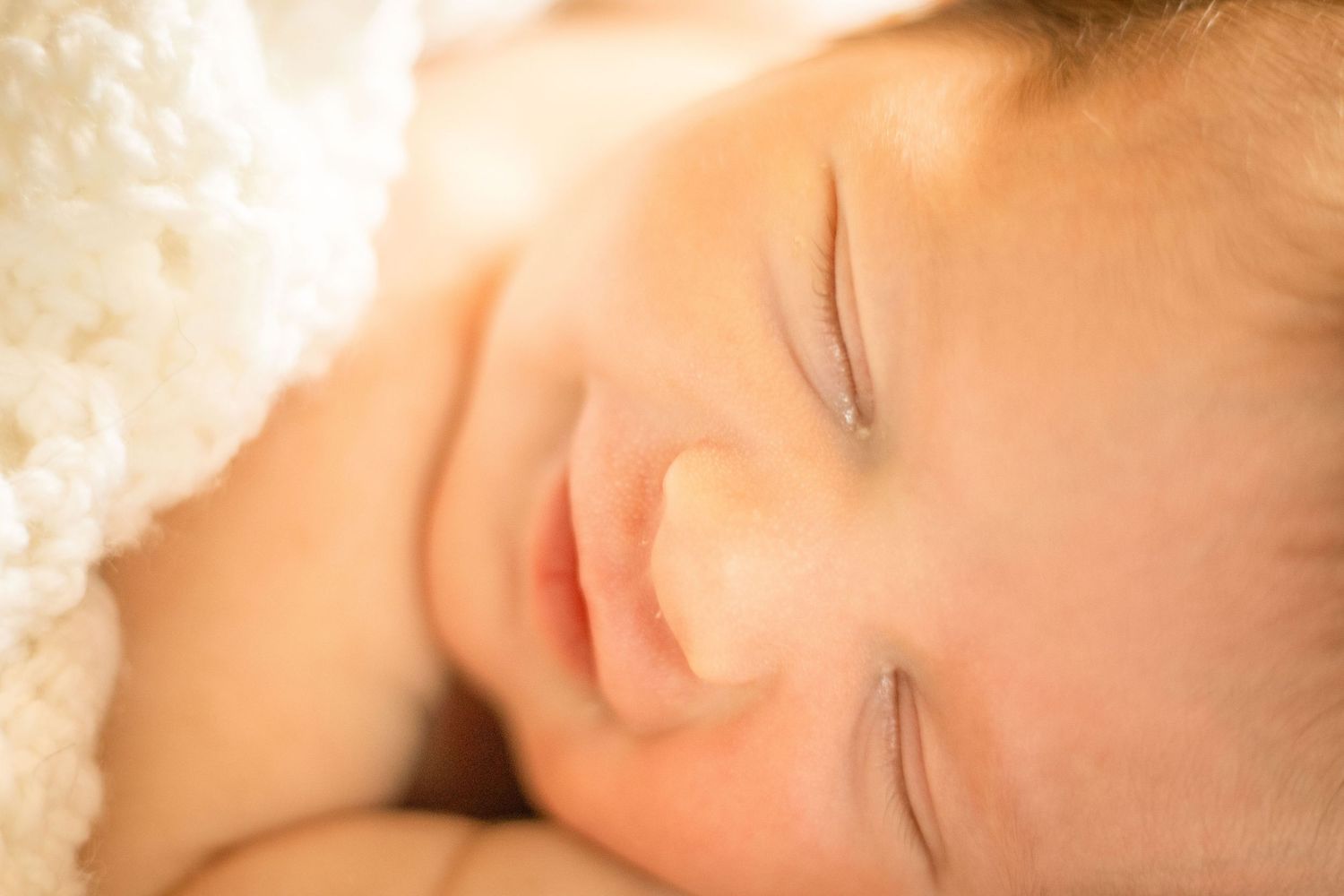 Newborn baby girl wrapped in a blanket