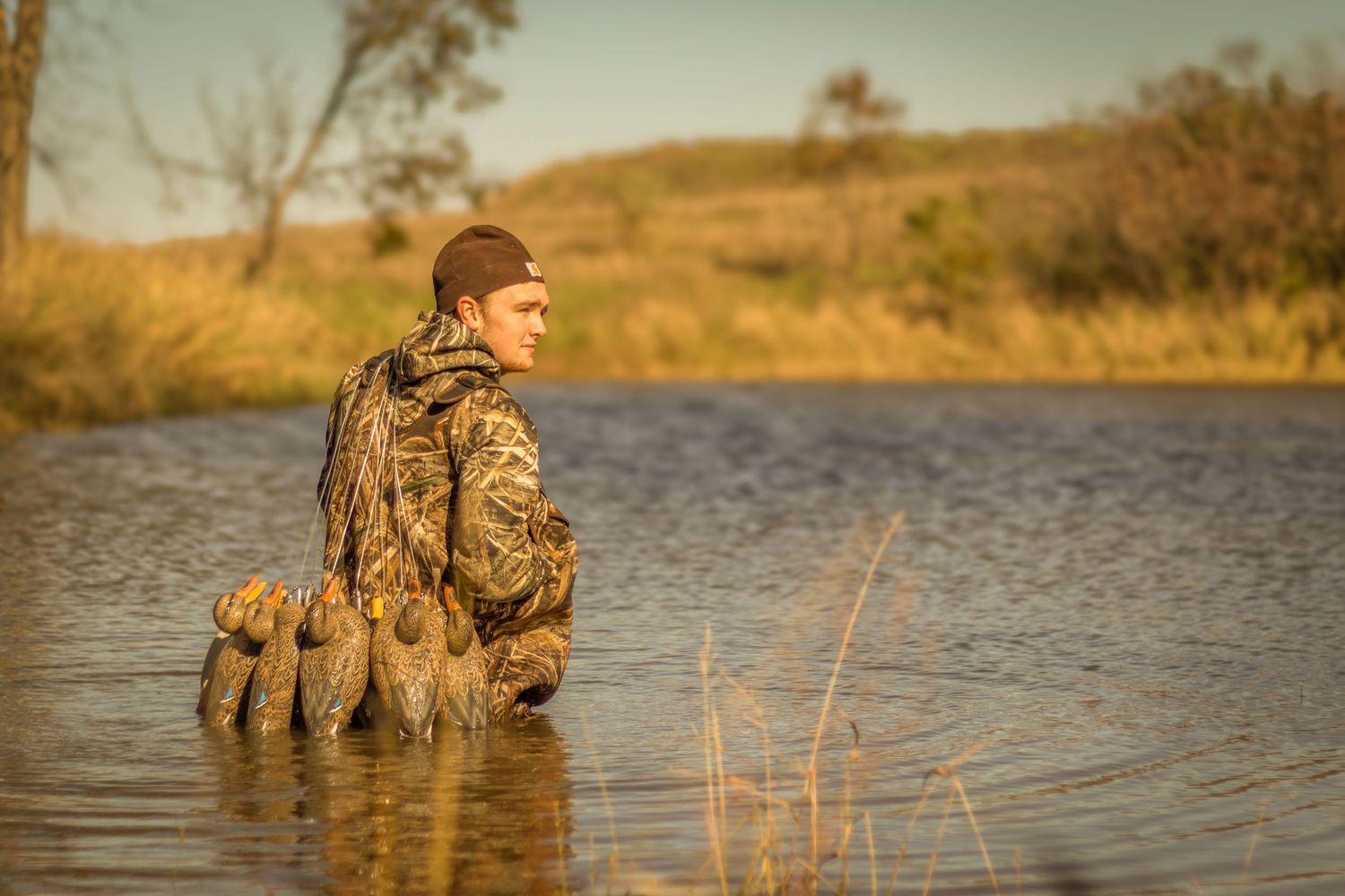Senior boy duck hunting