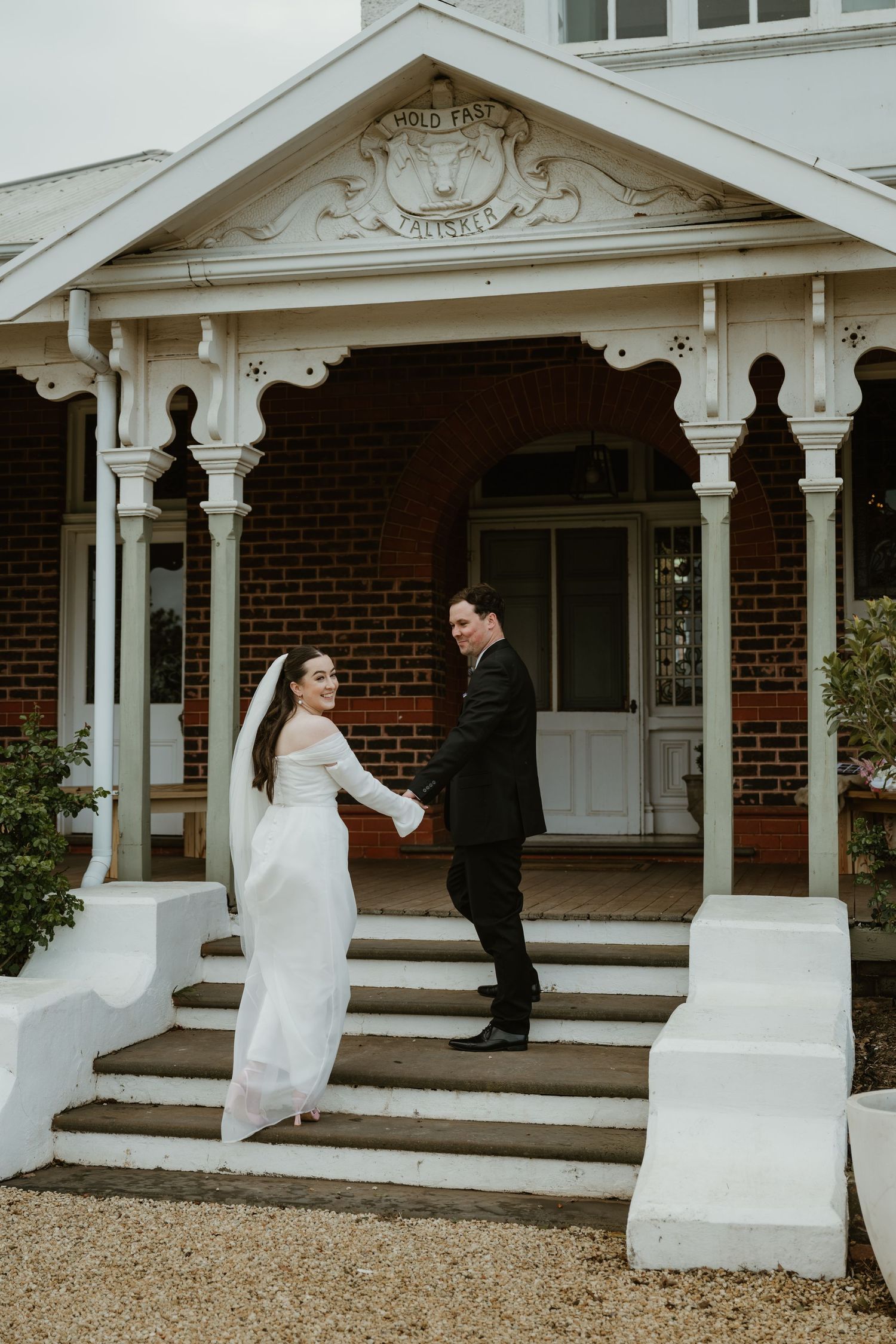 A sequence of romantic wedding moments captured on the white-columned porch of a brick building.