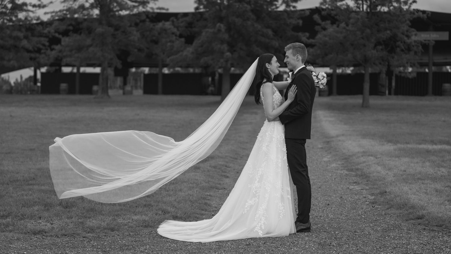 A romantic wedding photo montage showing dancing and embracing couples in black and white against an outdoor backdrop.