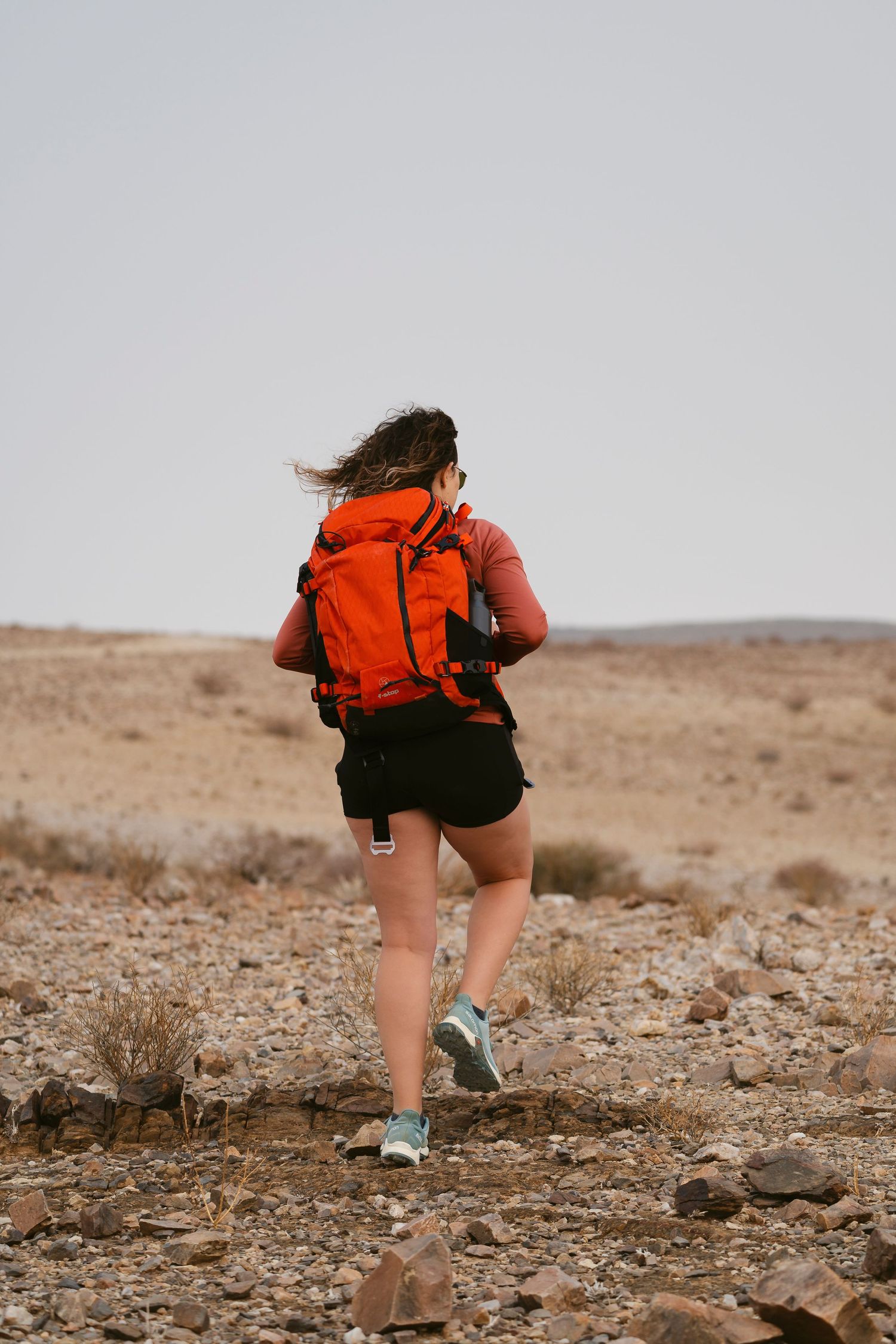 Girl hiking with f-stop gear bag