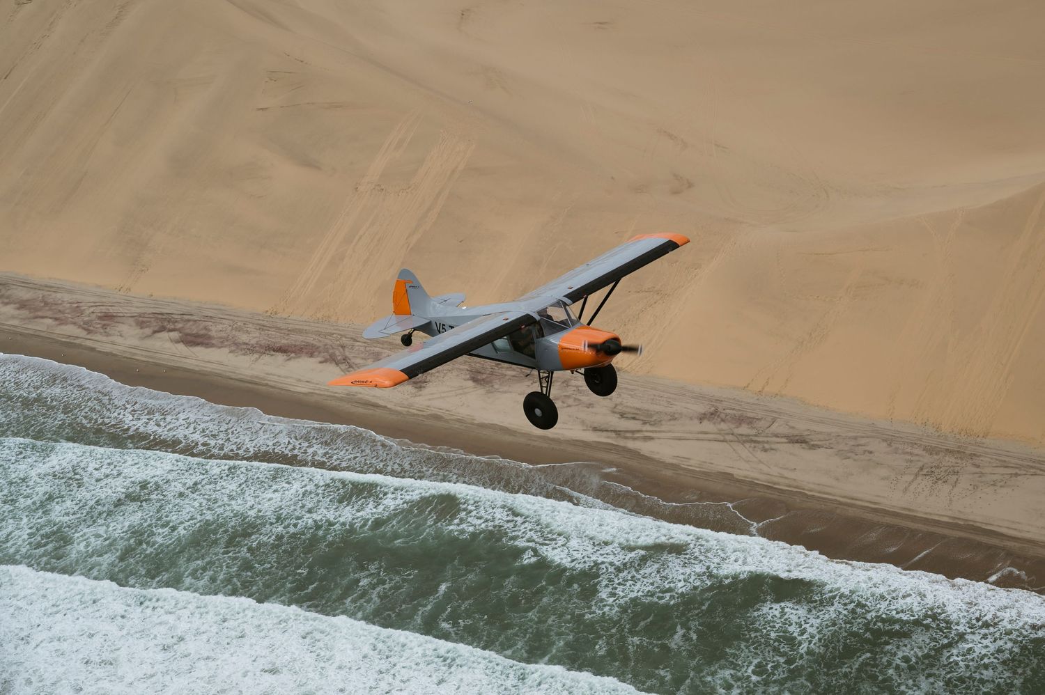 Maule M4 210C flying past sand dunes Namibia