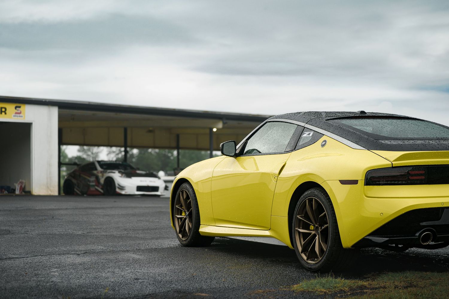 Side profile shots of yellow sports cars parked at a dealership or showroom.