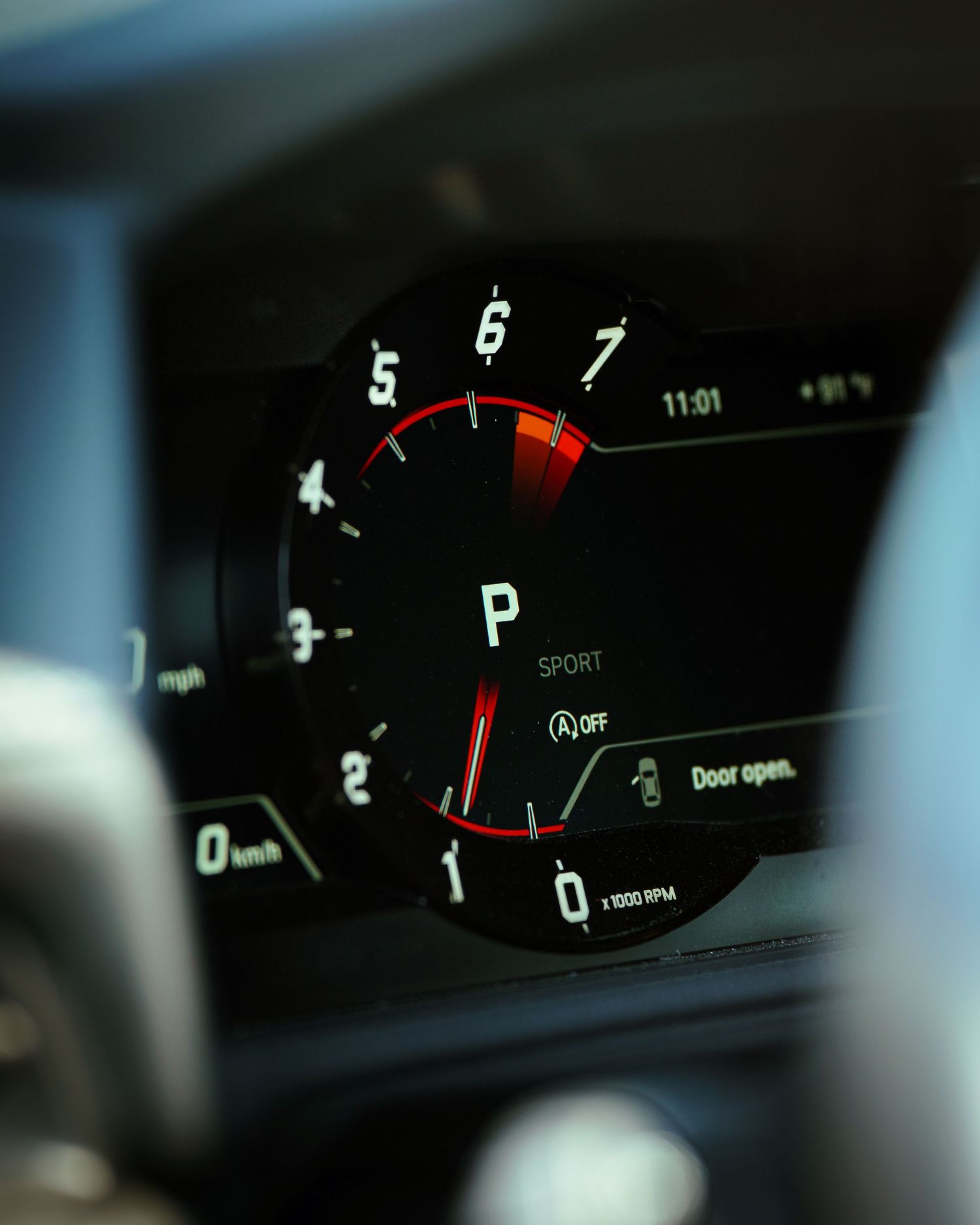 Close-up sequence of digital car dashboard displays showing various gauges and meters illuminated at night.