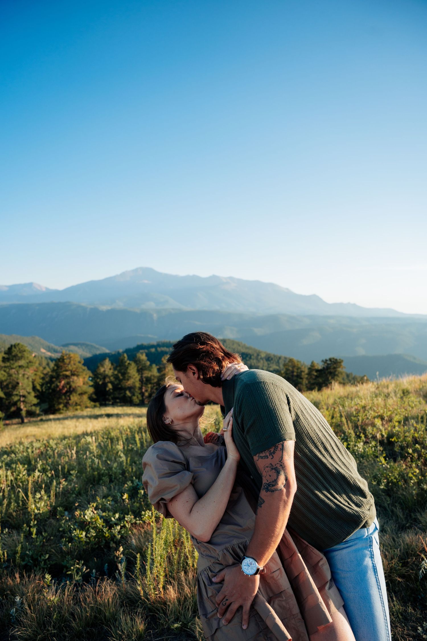 Man dipping woman in a kiss outside
