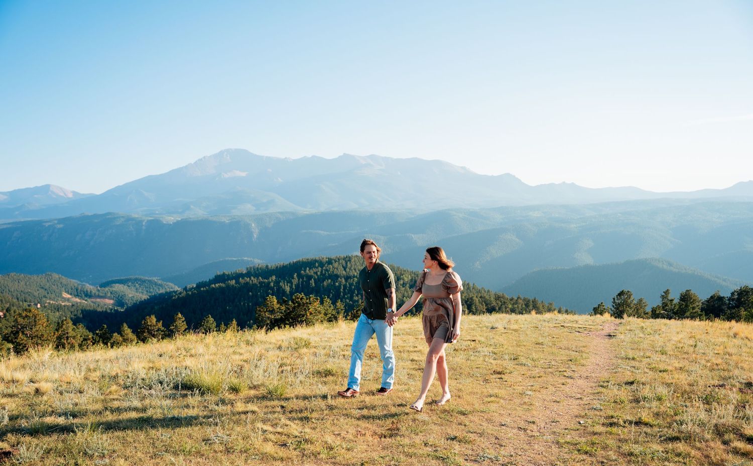 Couple walking with mountain view in back