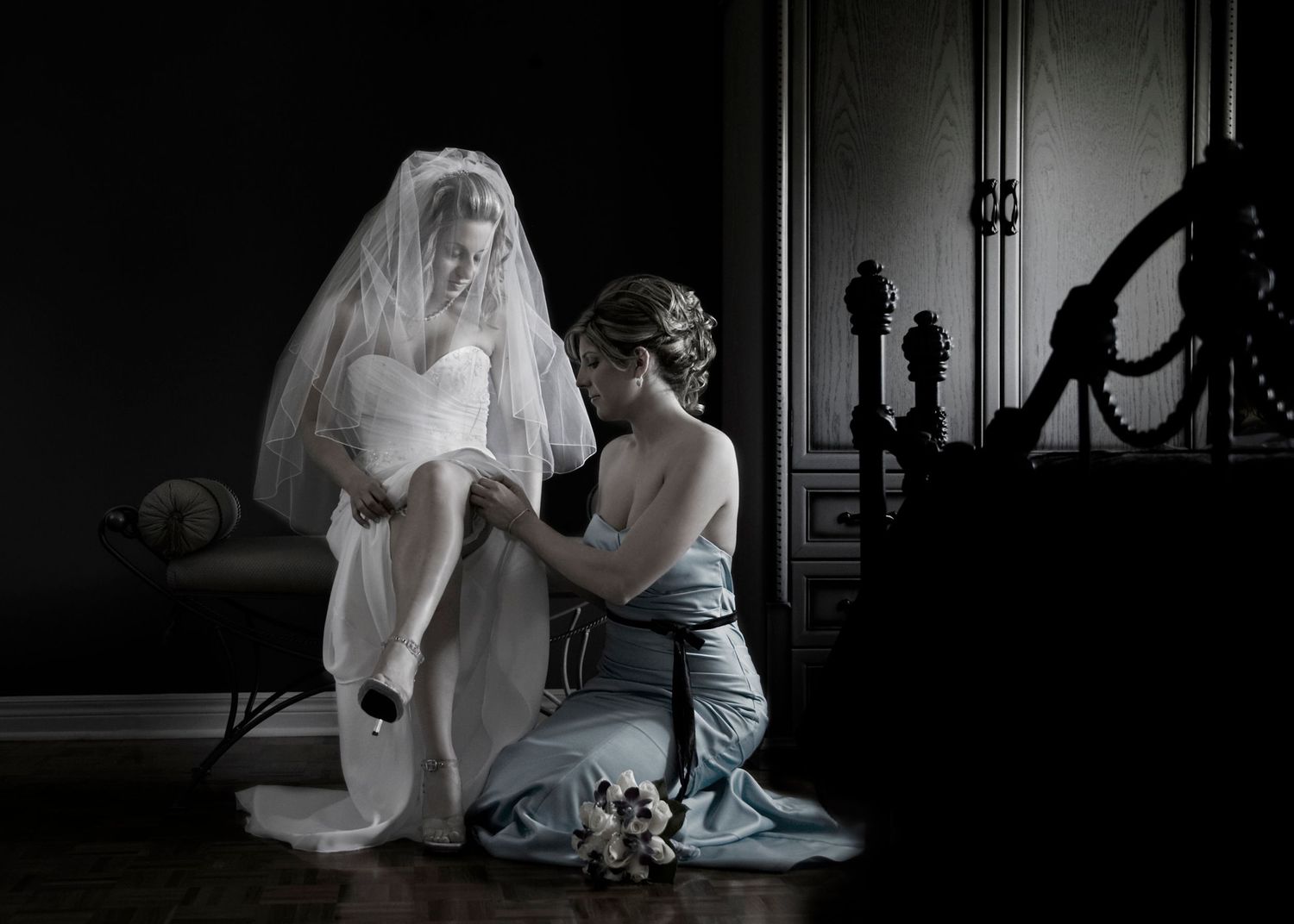 Black and white photo sequence showing a ghostly figure in flowing white fabric moving through a dark interior space.
