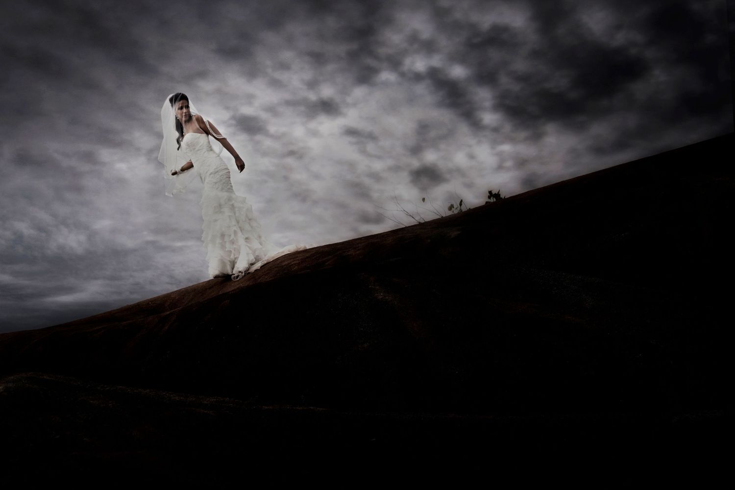 A silhouetted figure leaps between rocky cliffs against a dramatic cloudy sky in a series of action shots.
Horvath-Photography-Sam-Sciarrino