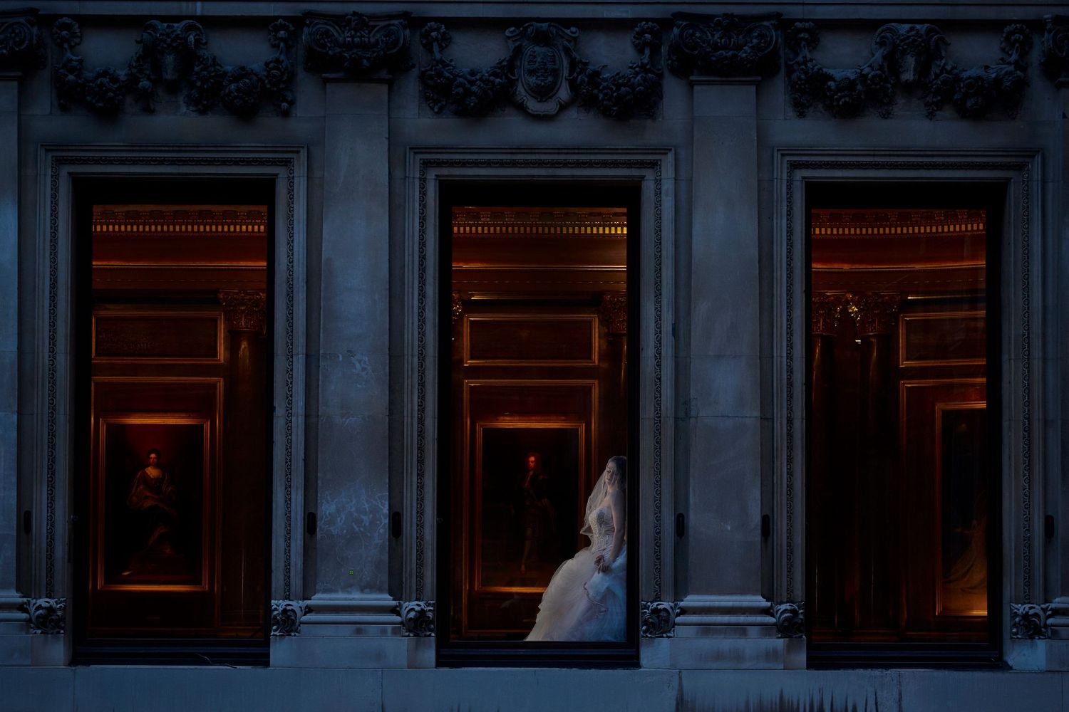 Ornate classical building exterior with illuminated windows at night and stone columns along the facade.
Horvath-Photography-Sam-Sciarrino