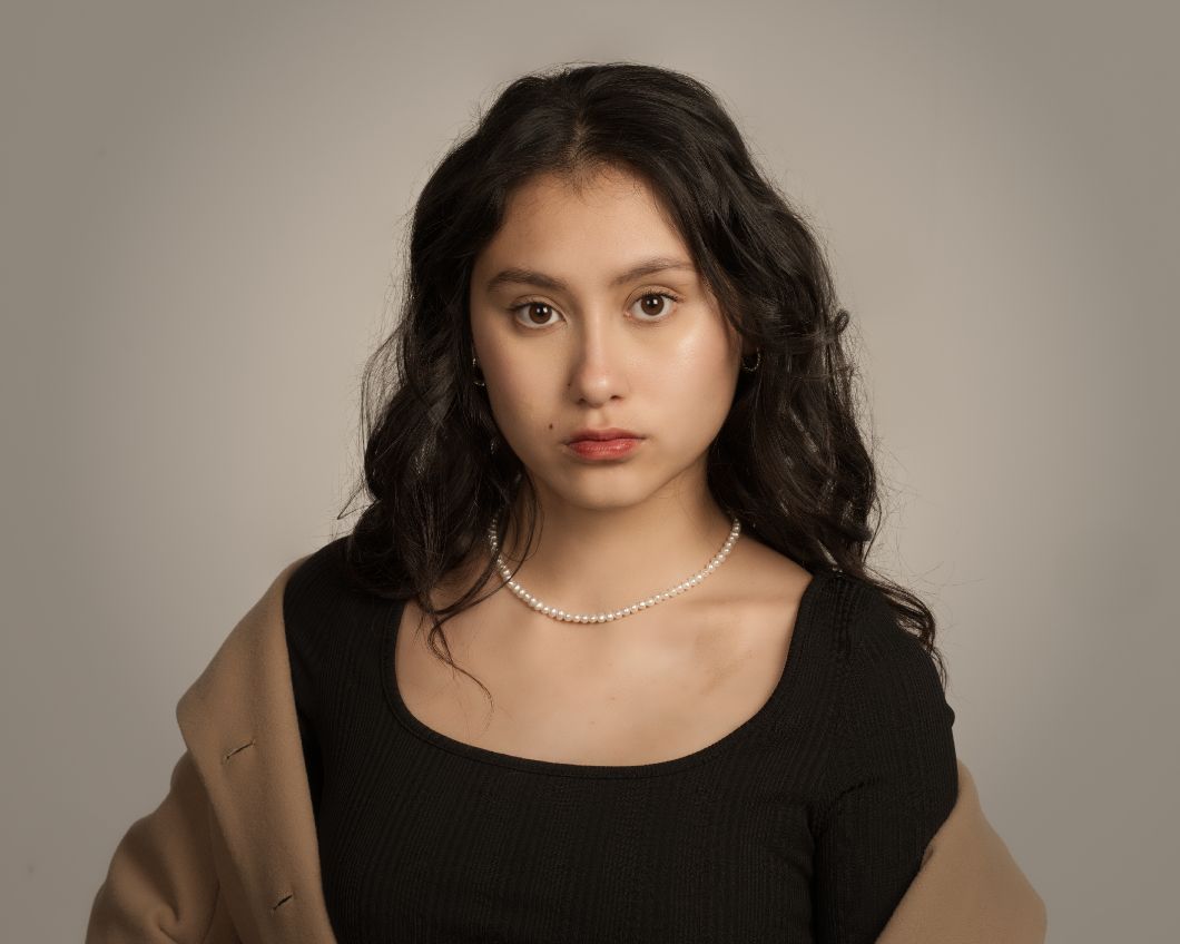 Studio portrait series featuring a black dress and pearl necklace against neutral beige backdrop.